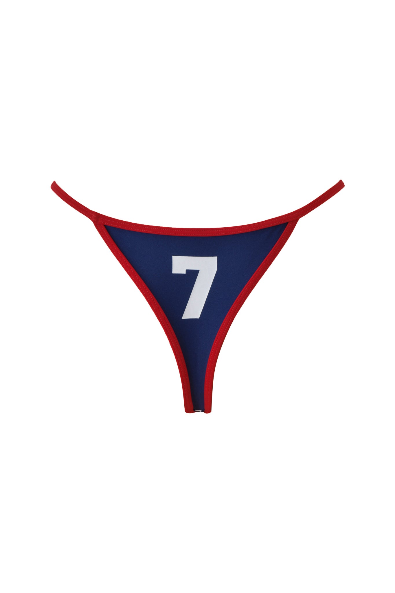The CARMELLA BIKINI BOTTOM - NAVY by I.AM.GIA is a bold blue thong with red trim, showcasing a large white number 7 on the front, designed with a low-rise waist and high-cut leg.