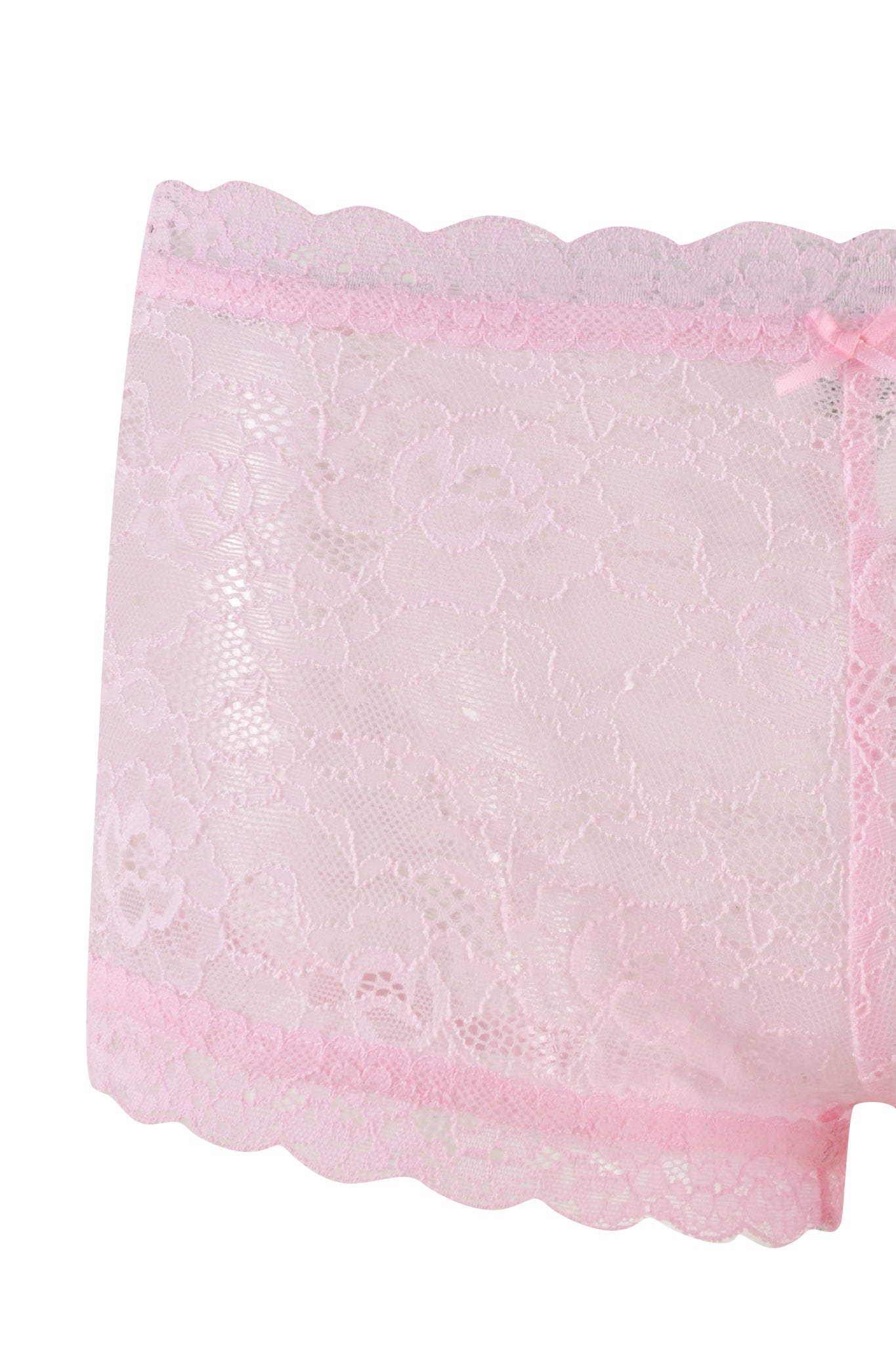 A close-up image of the SERINA SHORT - PINK : LACE women's underwear by I.AM.GIA, displaying a beautiful floral pattern. The pink lace underwear features scalloped edges at the waistband and leg openings, accented with a delicate bow detail on the waistband.