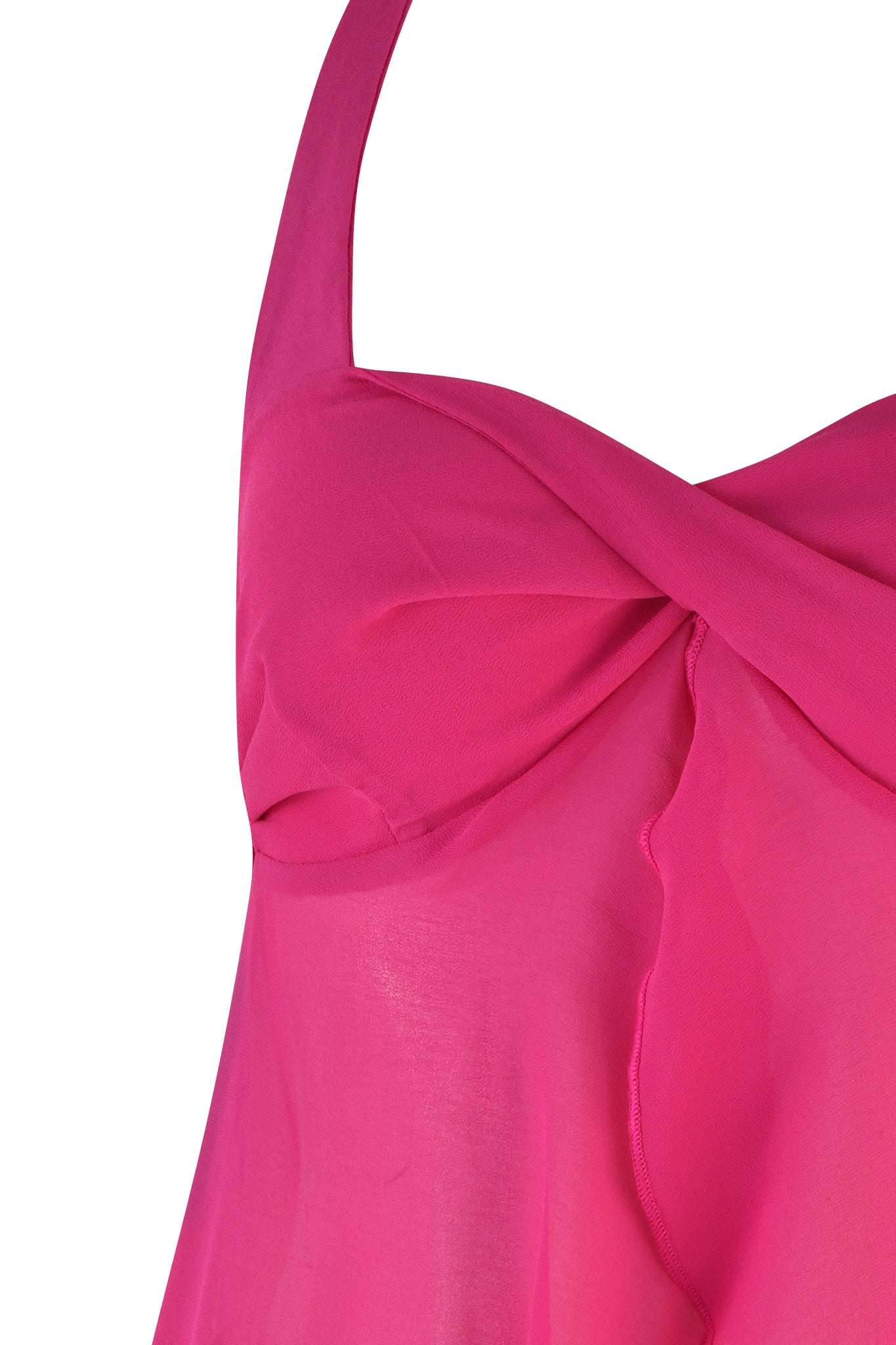 Close-up of a vibrant pink CHEYENNE SET by I.AM.GIA. The garment features a fitted bodice with a slight twist at the top of the bust, offering a stylish detail. The fabric appears lightweight and flowy, draping elegantly from the bust downwards.