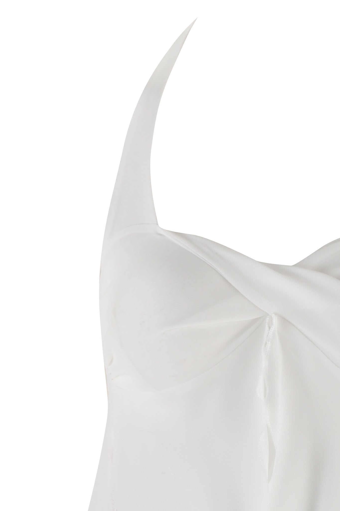 Close-up of the top part of the CHEYENNE SET - WHITE by I.AM.GIA. The garment features a minimalist design with a smooth texture and a triangular strap that appears to go over the shoulder. The fabric has a slight sheen, and the stitching is subtle.