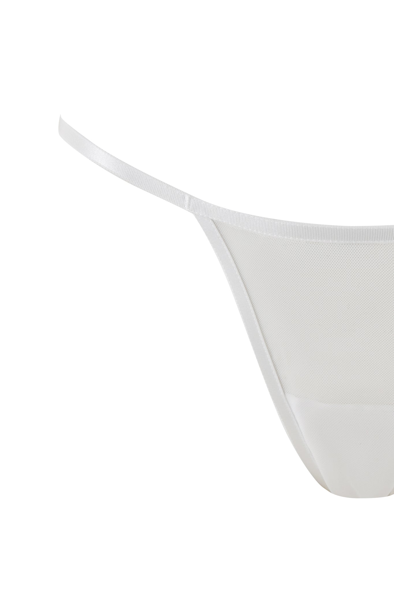 A close-up image of the LILAH SET - WHITE thong by I.AM.GIA, featuring thin side straps and sheer fabric. The thong's minimalist design looks sleek and delicate, with emphasis on the upper part of the underwear. The background is plain white.