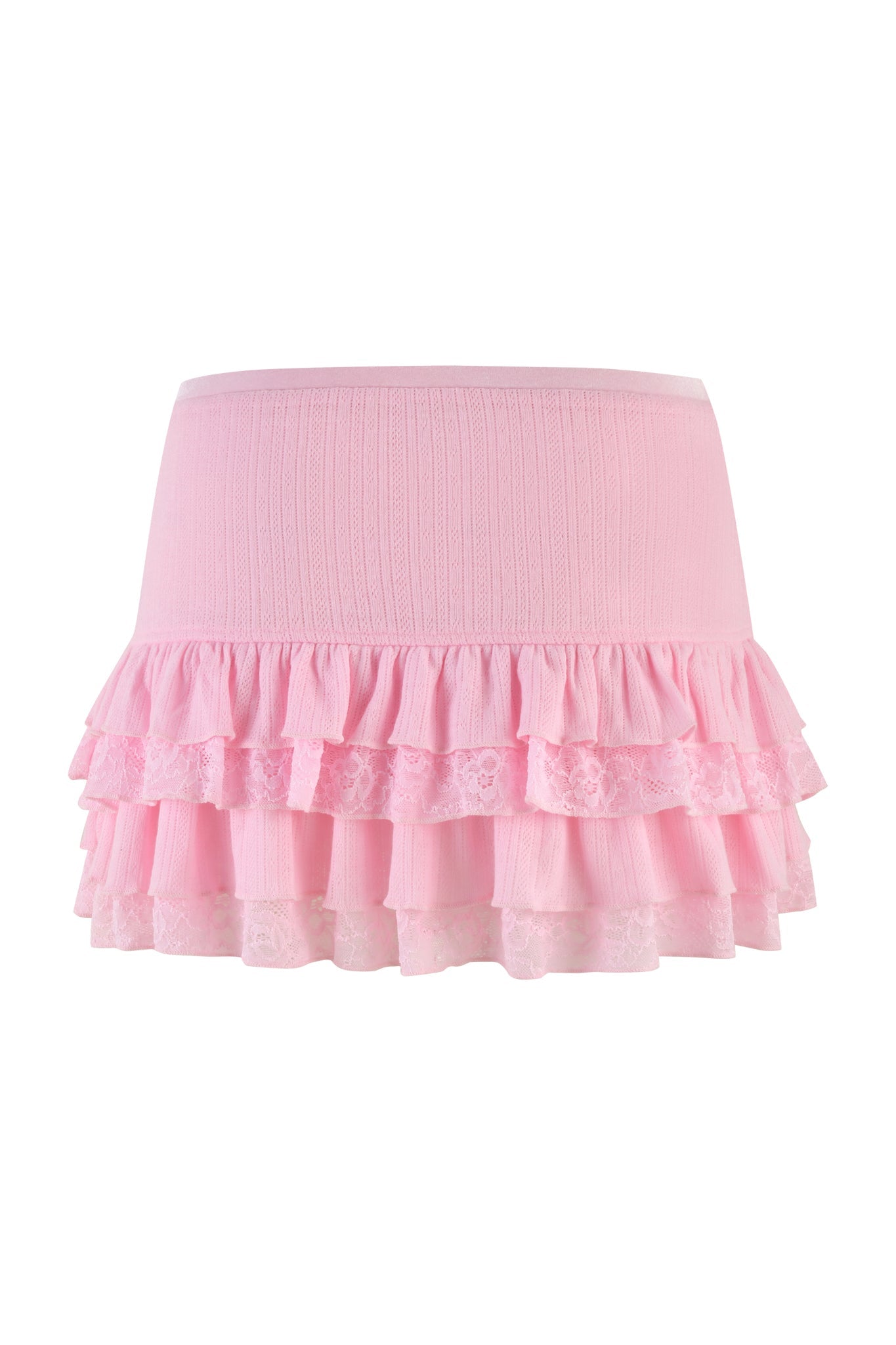The MIRABELLE SKIRT - PINK : LACE by I.AM.GIA is a form-fitting mini skirt that showcases a ribbed top section and two layers of frilled lace at the bottom, adding a textured, feminine touch to the garment.