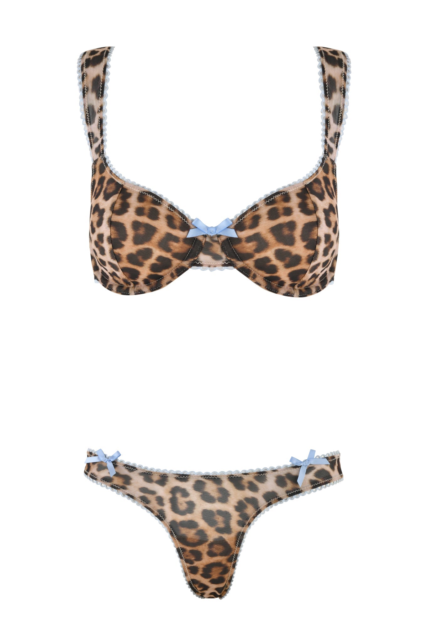 The AMANDA SET - NEUTRAL : LEOPARD by I.AM.GIA features a leopard print bra and matching thong. The bra is adorned with a blue bow in the center and trimmed with blue lace, while the thong complements it with blue lace trim and matching bows at the hips, providing versatile options for a bold and playful look.