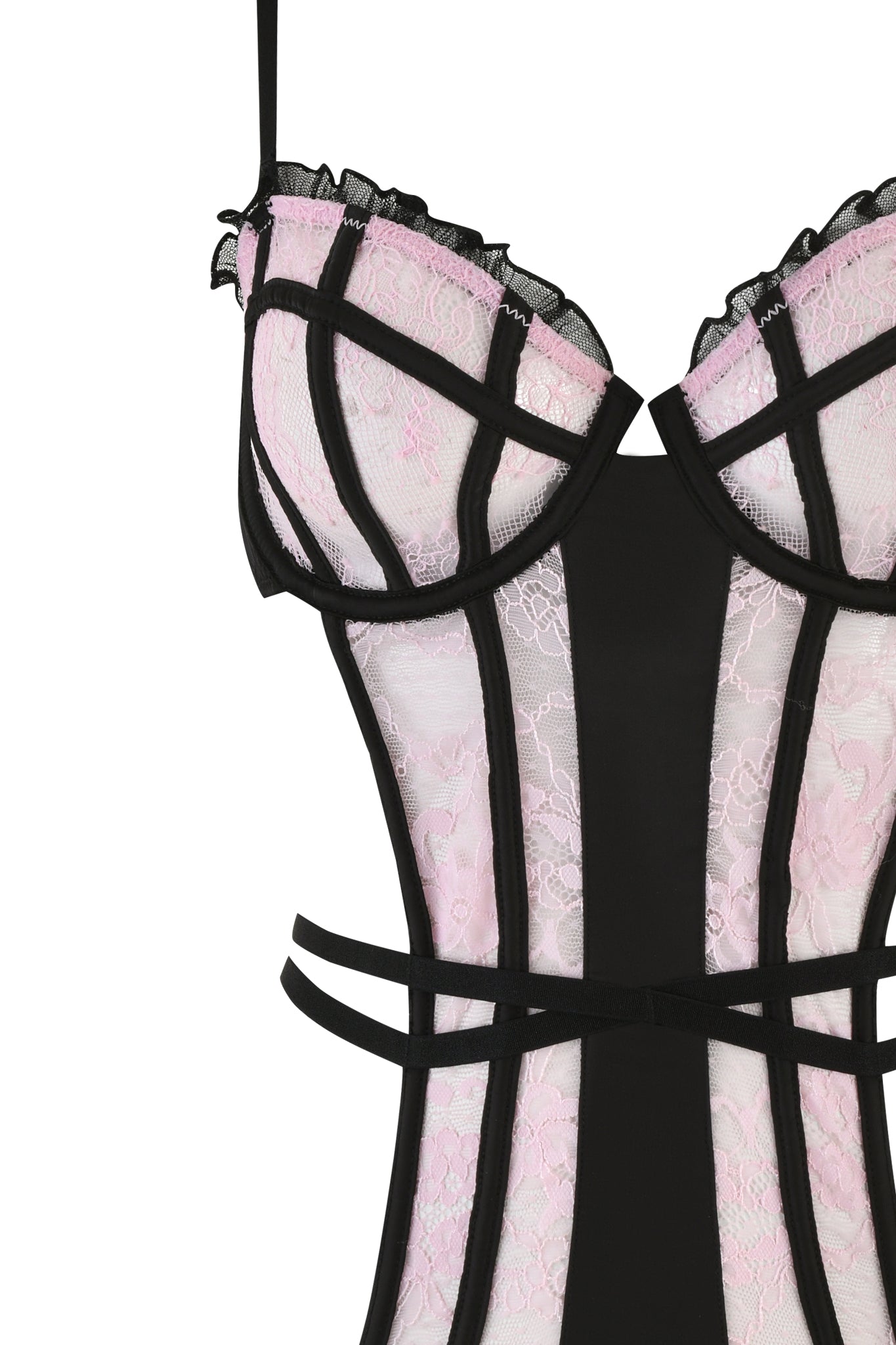 Introducing the MARILYN BODYSUIT in pink by I.AM.GIA: a stunning piece of vintage-inspired lingerie that highlights a pink lace design with elegant black trim. This bodysuit includes underwire cups and multiple vertical boning lines for enhanced structure, complemented by thin black straps. Its intricate pattern and striking contrast exude elegance and sophistication, reminiscent of a classic sweetheart neckline.