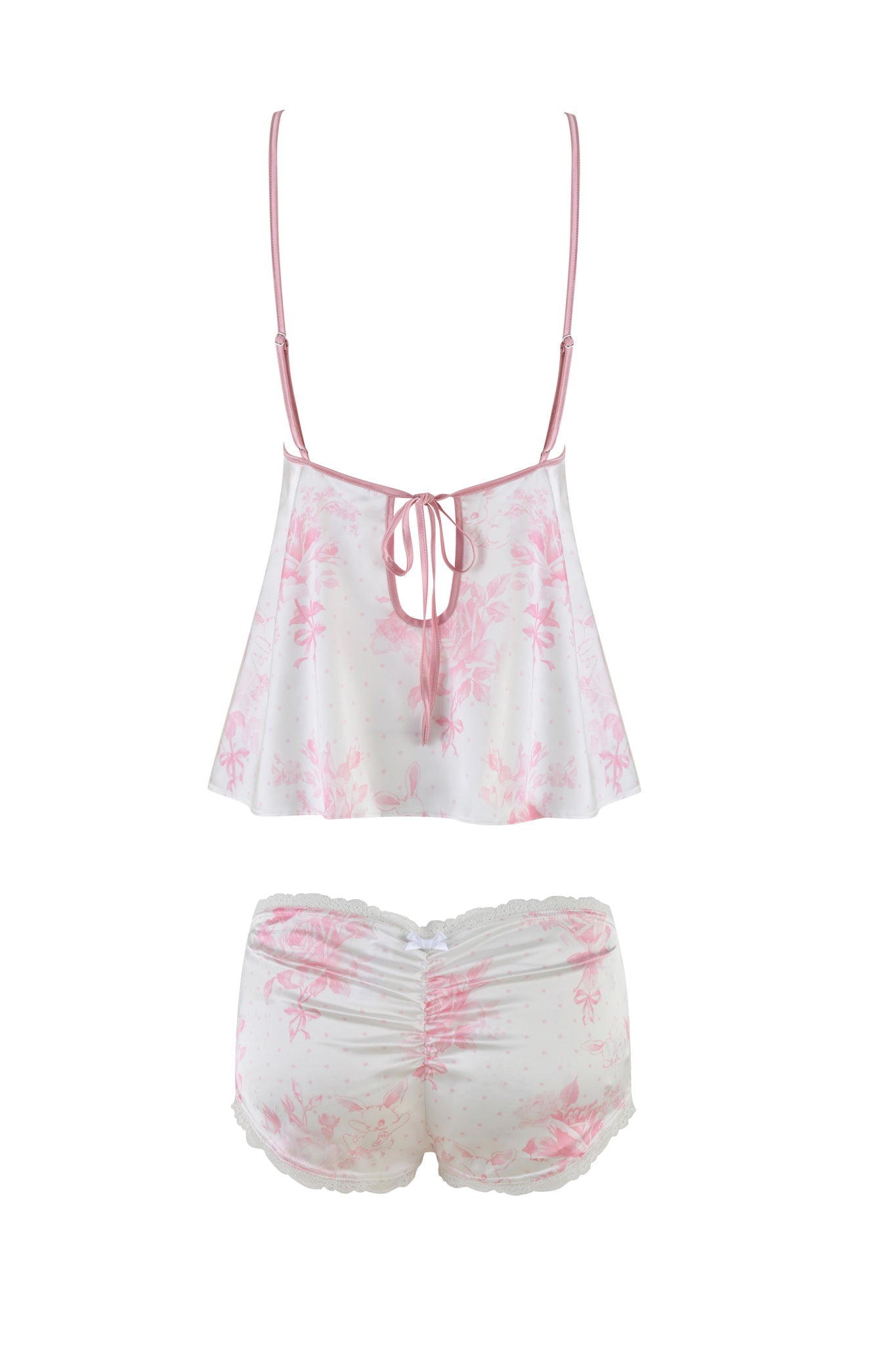 The BRIDGET CAMI 2 PIECE SET - PINK : FLORAL from I.AM.GIA includes a white camisole with a pink floral design and matching shorts. The camisole, inspired by vintage slip dresses, has thin straps and a small bow at the back. Both pieces are elegantly finished with delicate lace trim for added charm.