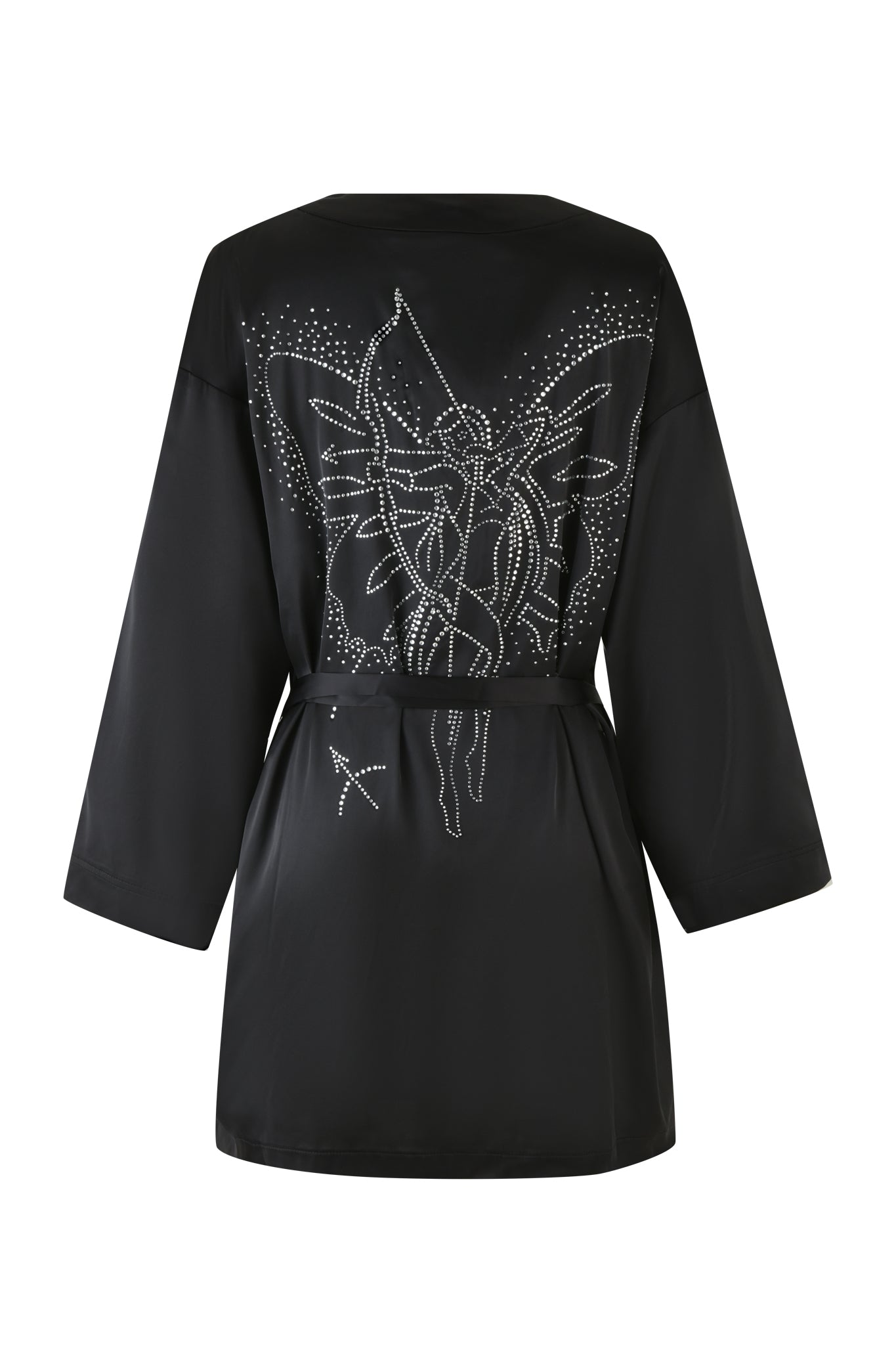 The LARSA 2.0 SLEEP ROBE - BLACK by I.AM.GIA is an exquisite black robe with long sleeves, adorned with a captivating star and fairy motif in white rhinestones on the back. Made from luxurious satin fabric, it includes a waist tie closure to bring elegance to your nighttime routine.
