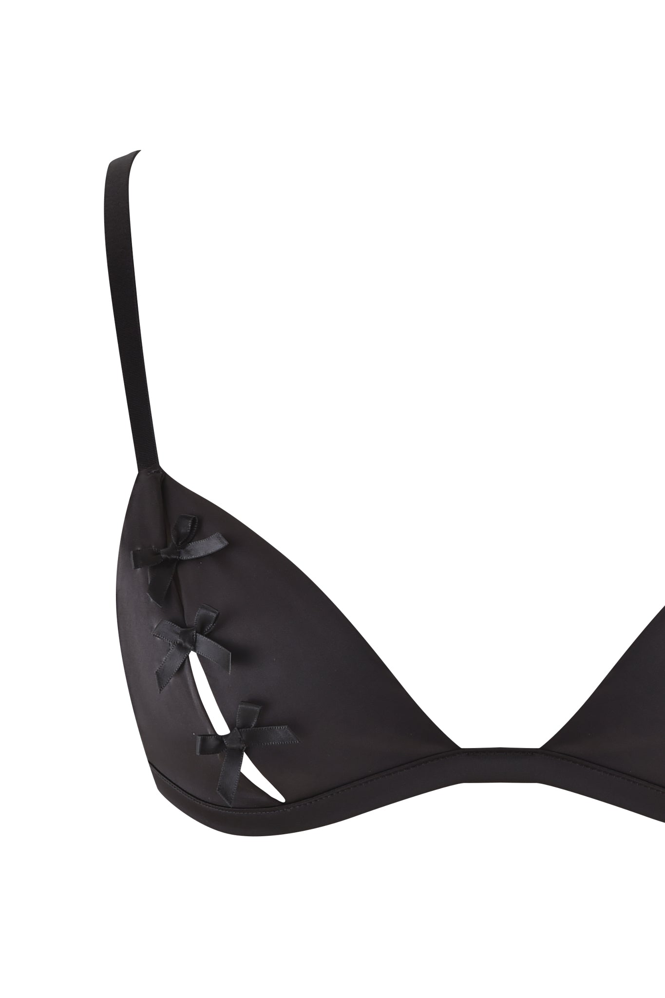 Discover the CAROLINA PEEKABOO SET - BLACK by I.AM.GIA, featuring a sleek black bra adorned with three small decorative bows on the left cup and complemented by thin adjustable straps. This minimalist and stylish design offers an elegant touch with a hint of allure for those seeking sophistication.
