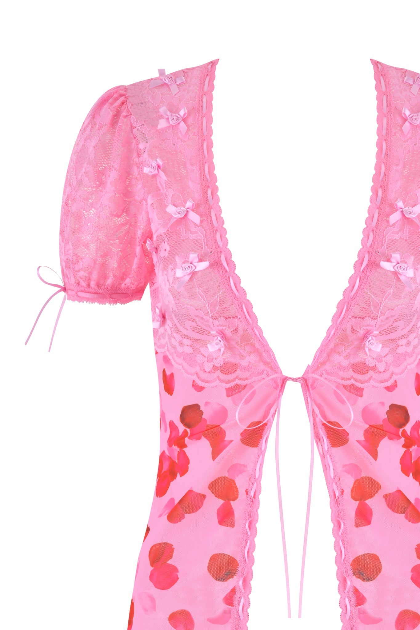 Close-up of the I.AM.GIA exclusive VERONA CHEMISE in pink, featuring floral and pretty petal patterns. It has a deep V-neck with lace details, puff sleeves, a small bow at the neckline, and sleeves edged with delicate pink ribbon.