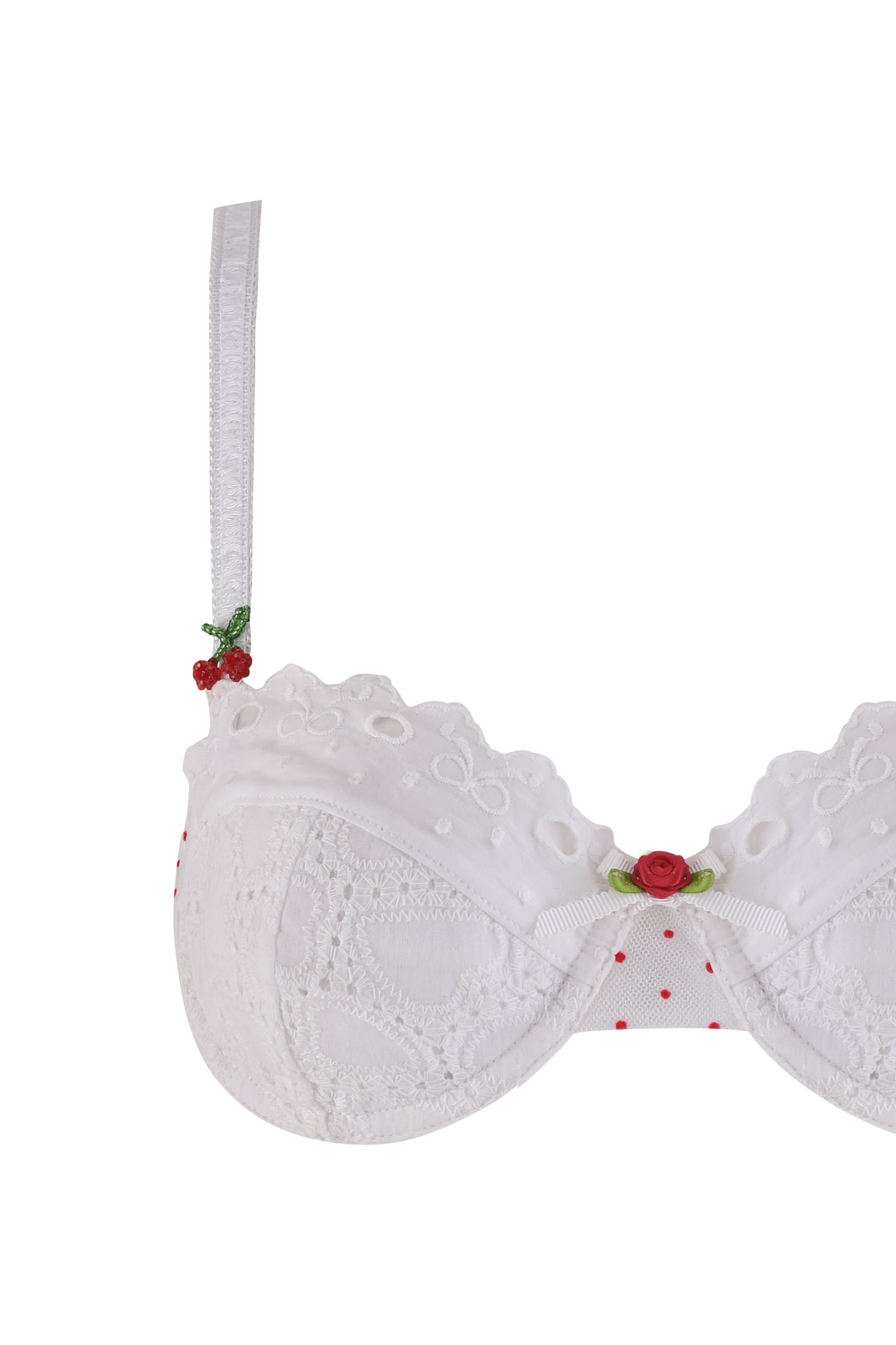 The CHRISSY SET - WHITE by I.AM.GIA features a white lace underwire bra with red polka dots, floral lace accents, and red rose embellishments on the adjustable straps and center front. Only the left half of the bra is shown against a white background.