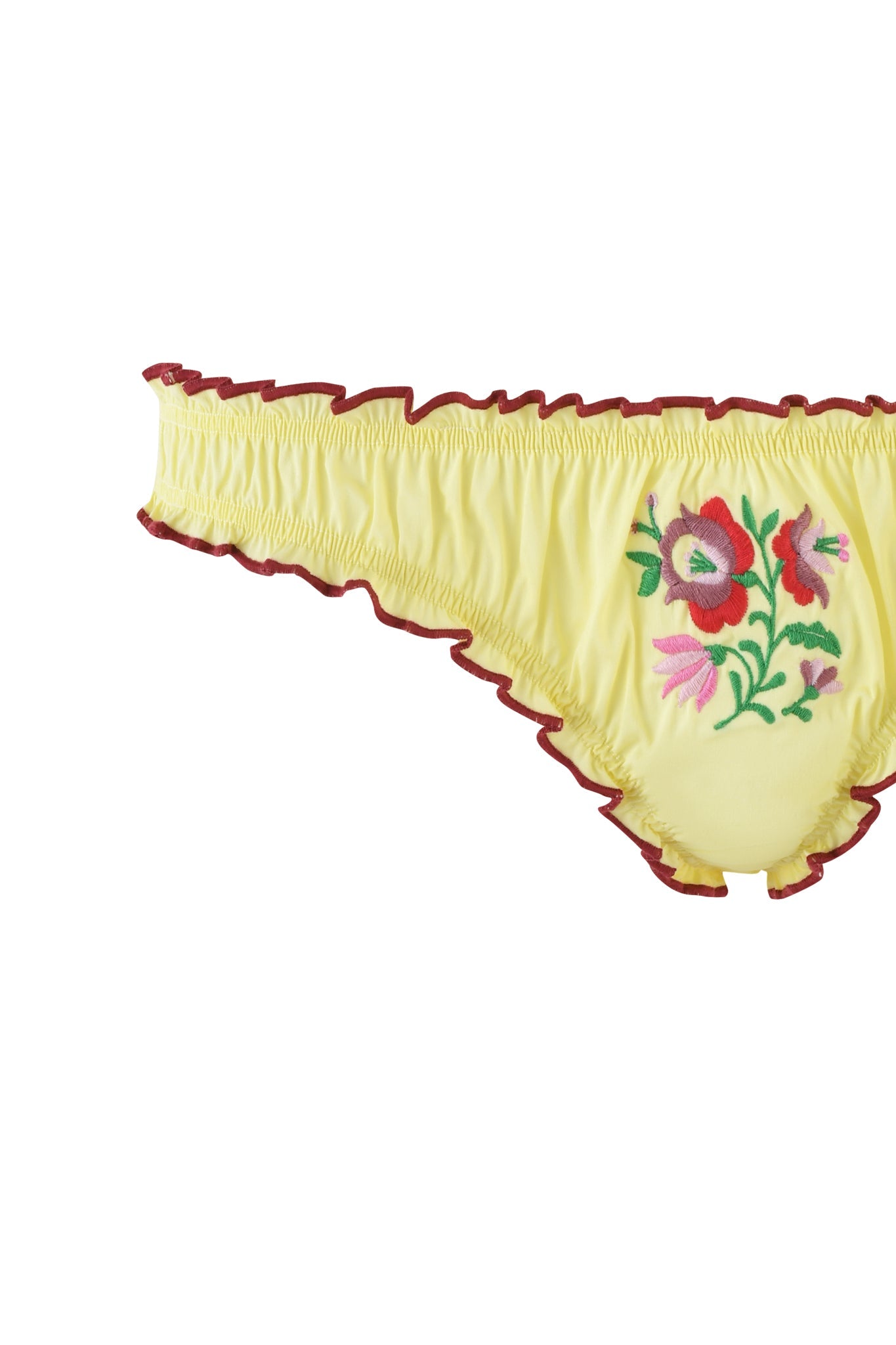 The CLOVER SET - YELLOW by I.AM.GIA is a yellow, ruffled underwear with red trim and exquisite floral embroidery in pink, red, and green. Pair it with a ruched lingerie set that enhances its vibrant floral patterns.