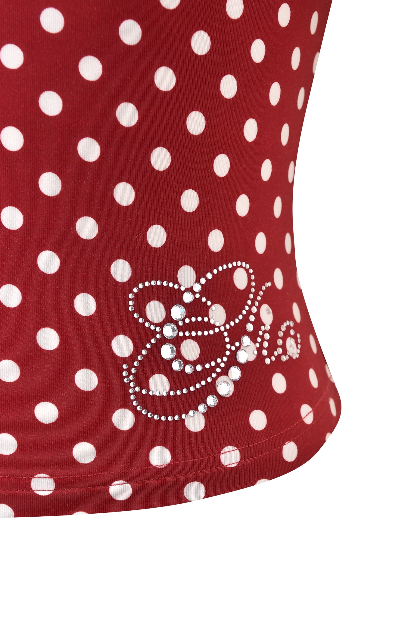 The MELANIE CAMI - RED POLKA DOT by I.AM.GIA features a playful polka-dot print and a sparkling diamante logo near the hem for an eye-catching finish.