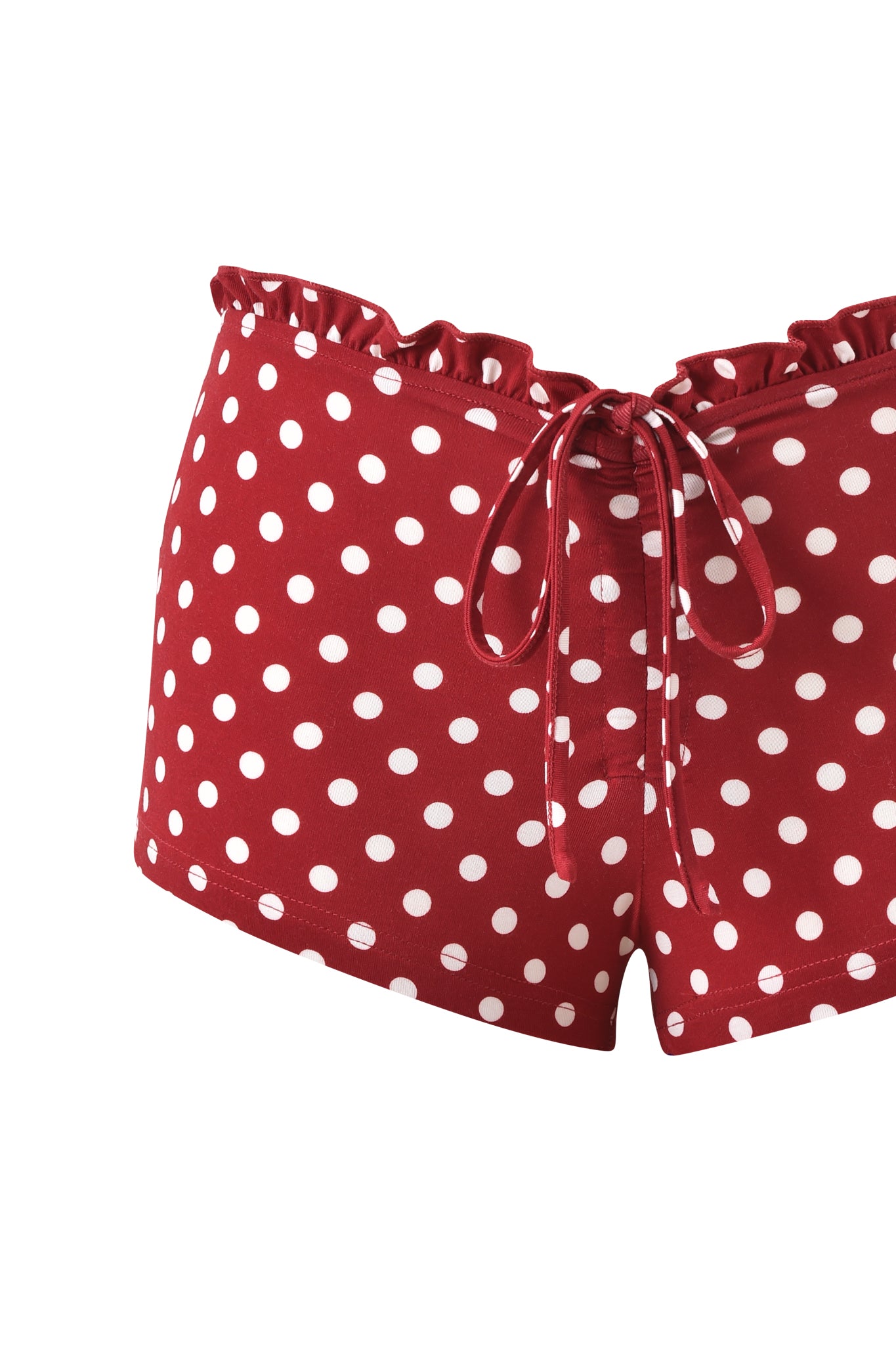 The I.AM.GIA MELANIE SHORT - RED POLKA DOT features a ruffled waistband and front drawstring tie. These bamboo jersey hot shorts add playful, retro-inspired charm and fun flair to any summer look.