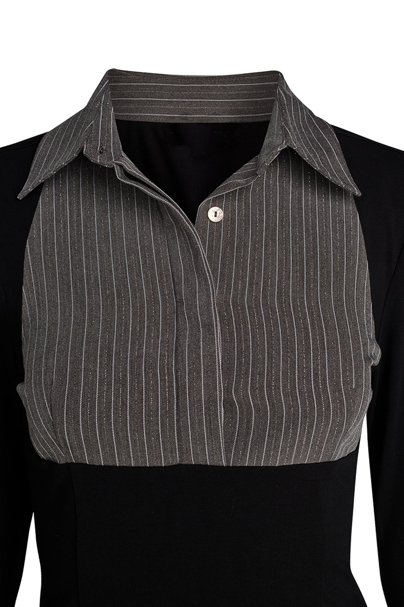 Close-up of a garment showcasing the upper portion of the I.AM.GIA SHARAH TOP in black and grey, featuring a pinstriped grey collar and a bib-like front panel. The open collar reveals a single button on the underneath panel. The fabric of the top appears to be structured and smooth.