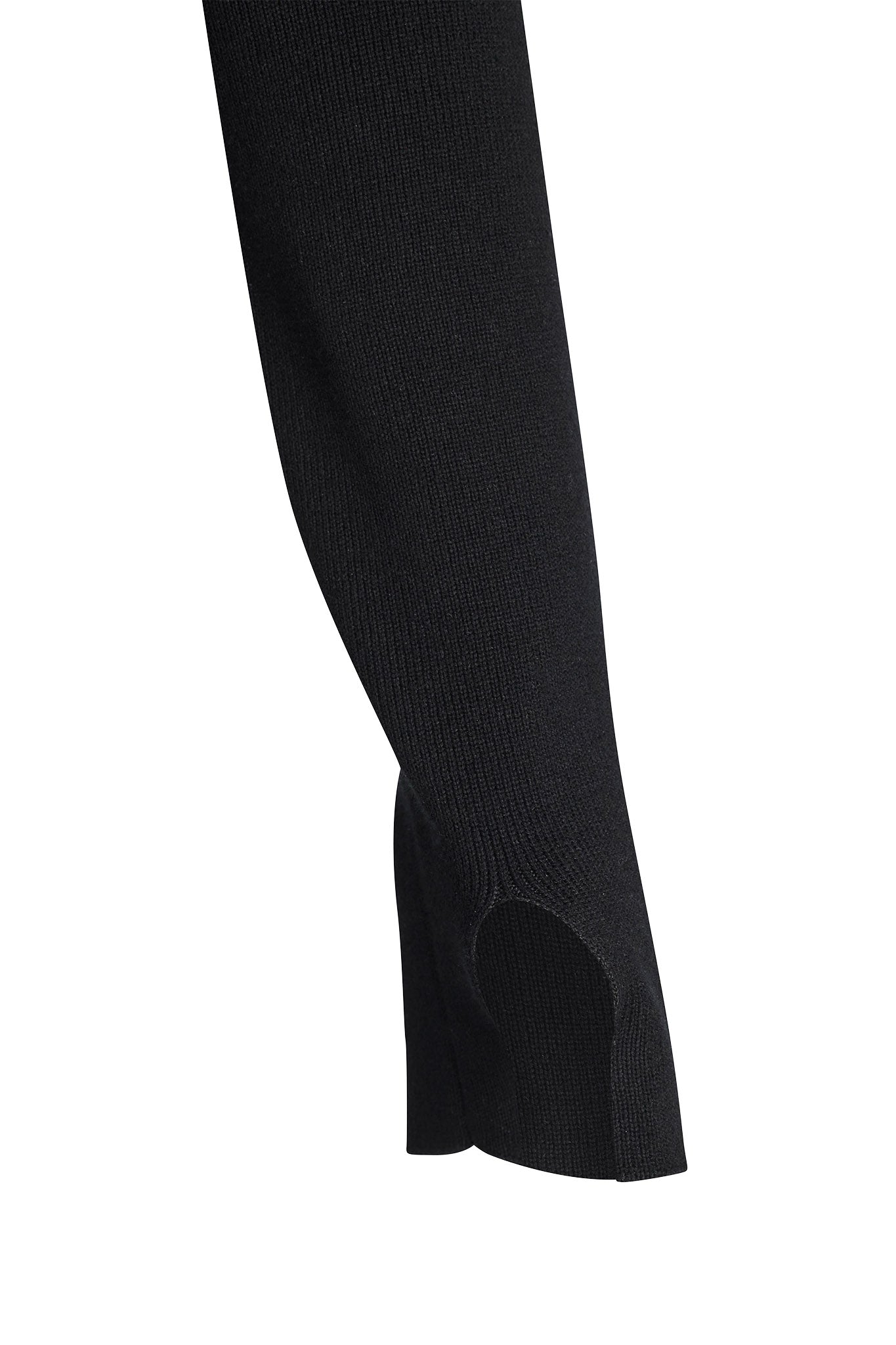 Close-up of a black fabric sleeve with a thumbhole, likely from the I.AM.GIA GISELLE TOP - BLACK. Designed to cover the hands partially and provide comfort and warmth, the ribbed and textured fabric adds a stylish touch.