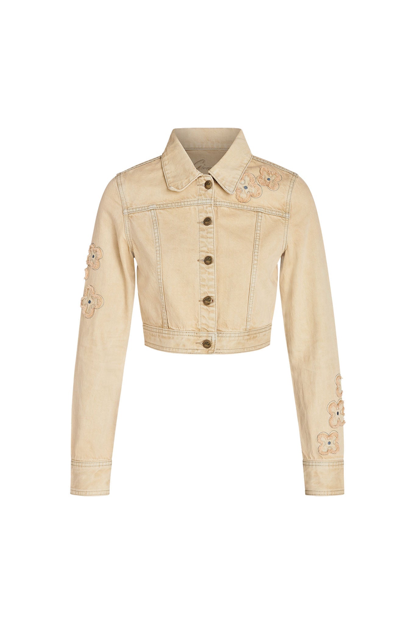 Introducing the FAUNA JACKET - BEIGE : TAN DENIM by I.AM.GIA, a light beige, cropped denim jacket with elegant floral embroidery. This stylish piece features a button-down front, pointed collar, and long sleeves each adorned with flower patches. The subtle stitching details enhance its casual yet chic look.