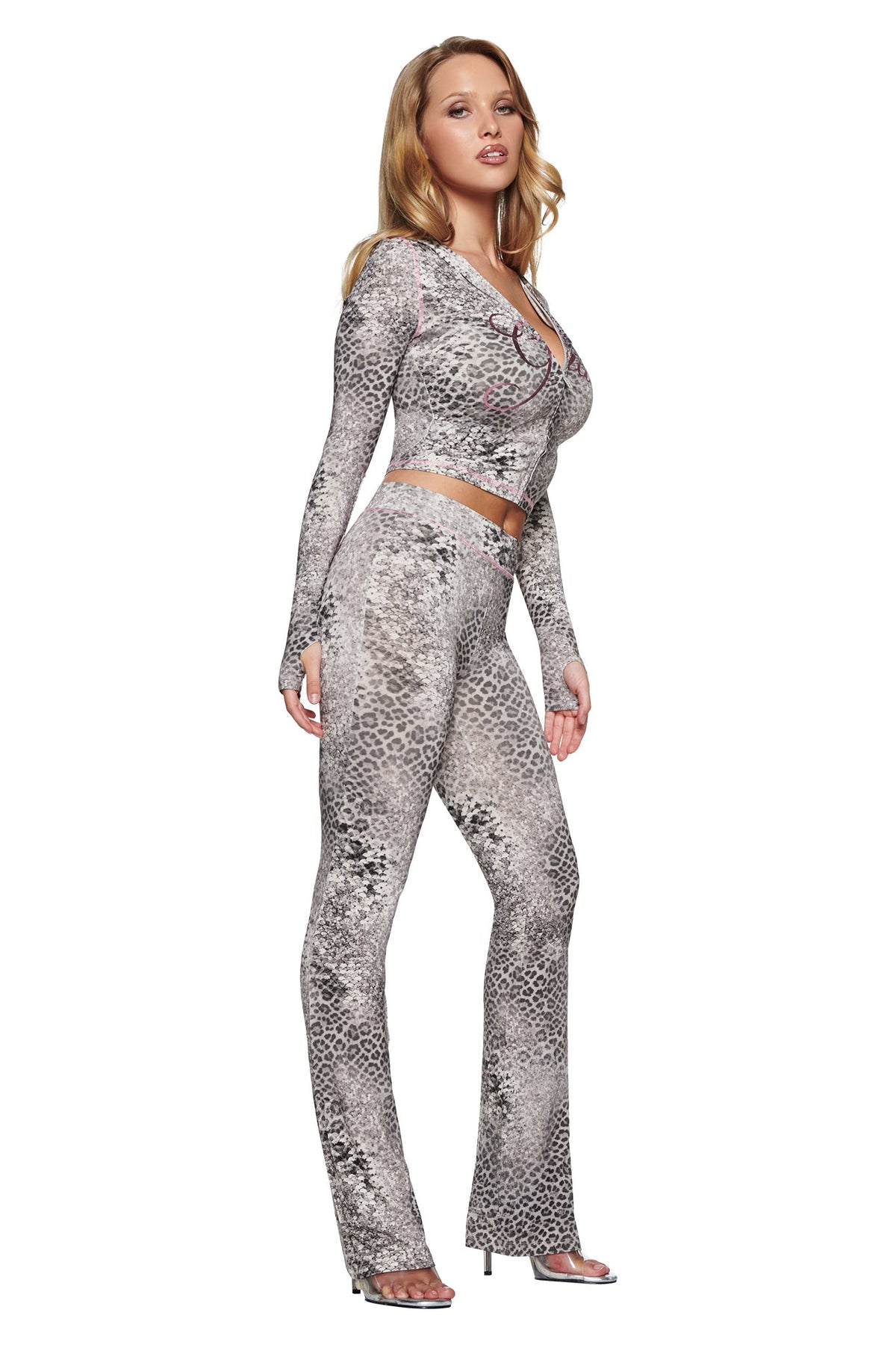 A person wearing a BLARE HOODIE - SILVER LUXE LEOPARD and matching flared pants in a silver leopard print.