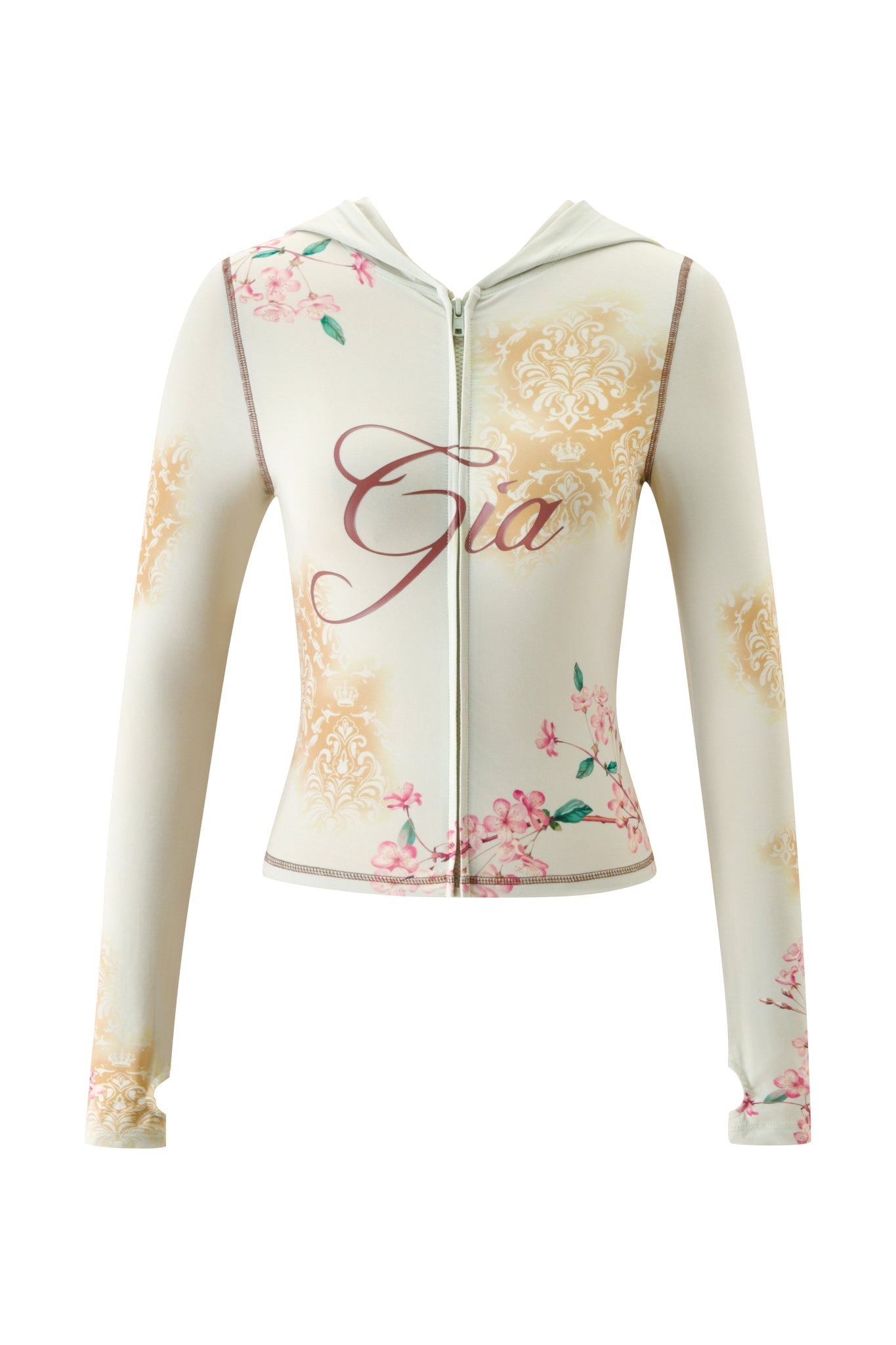 The BLARE HOODIE - BLOSSOM by I.AM.GIA is a cream-colored zip-up hoodie featuring floral and damask blossom prints, with “Gia” boldly displayed in large cursive letters across the chest.