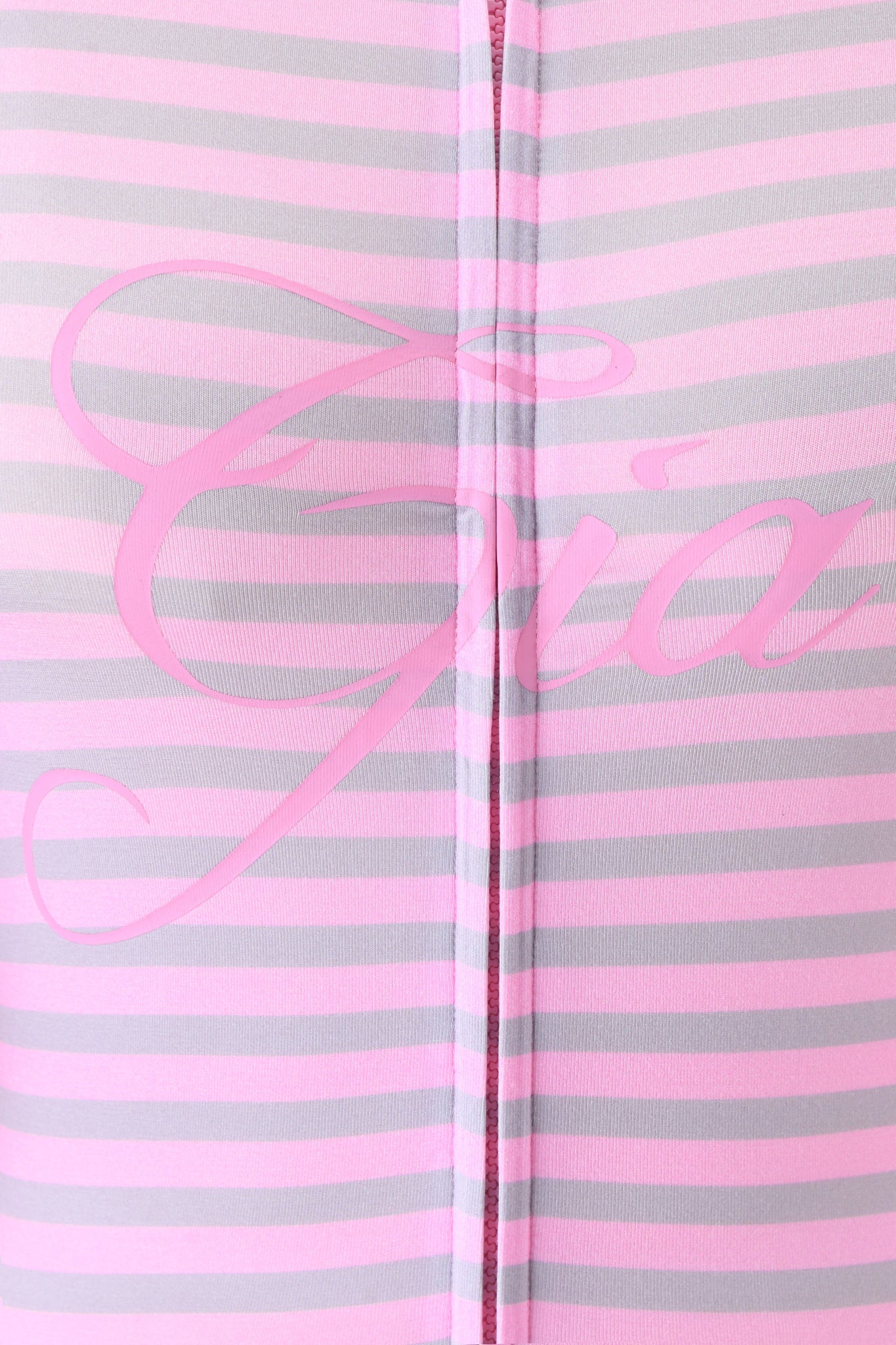 Close-up of the BLARE HOODIE - LIGHT PINK STRIPE by I.AM.GIA, featuring pink and light gray horizontal stripes with "Gia" in pink cursive across the center.