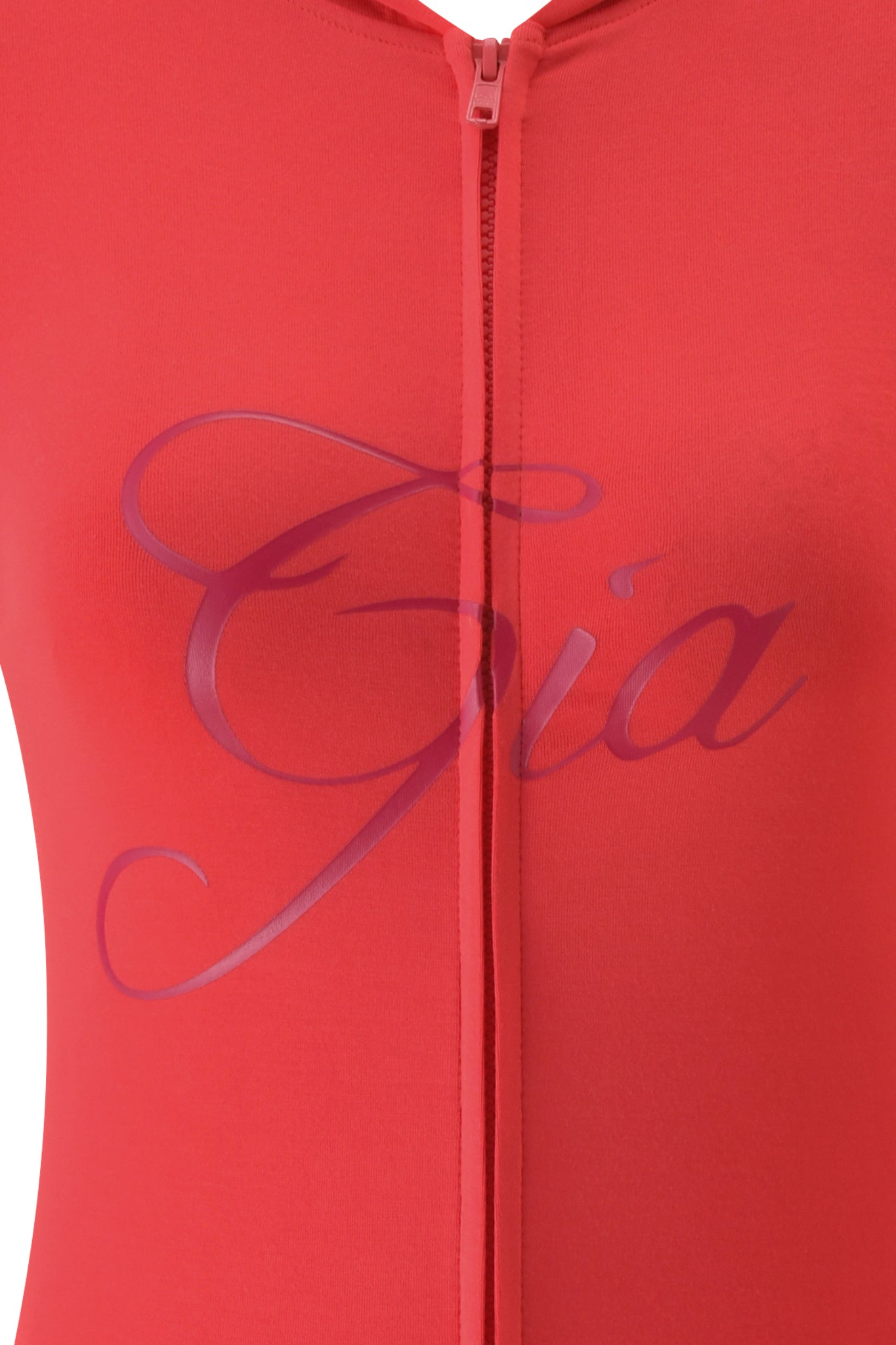 Close-up of the BLARE HOODIE - PAPAYA by I.AM.GIA, showcasing a central zipper and "Gia" in elegant purple cursive across the chest.