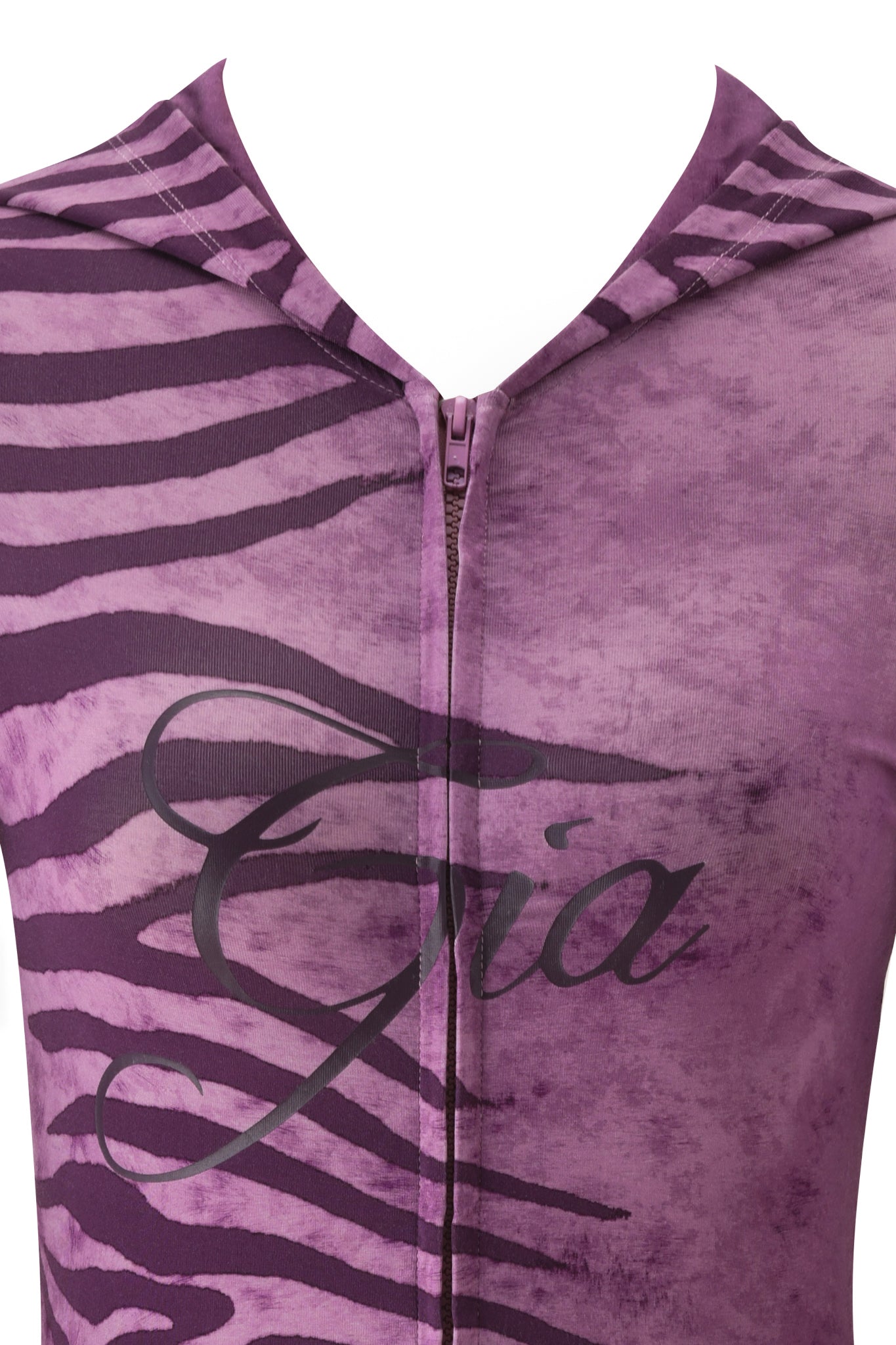 Close-up of the BLARE HOODIE - PLUM WILD SIDE by I.AM.GIA: a purple and black zebra print bamboo hoodie with a front zipper and "Gia" in cursive across the chest.