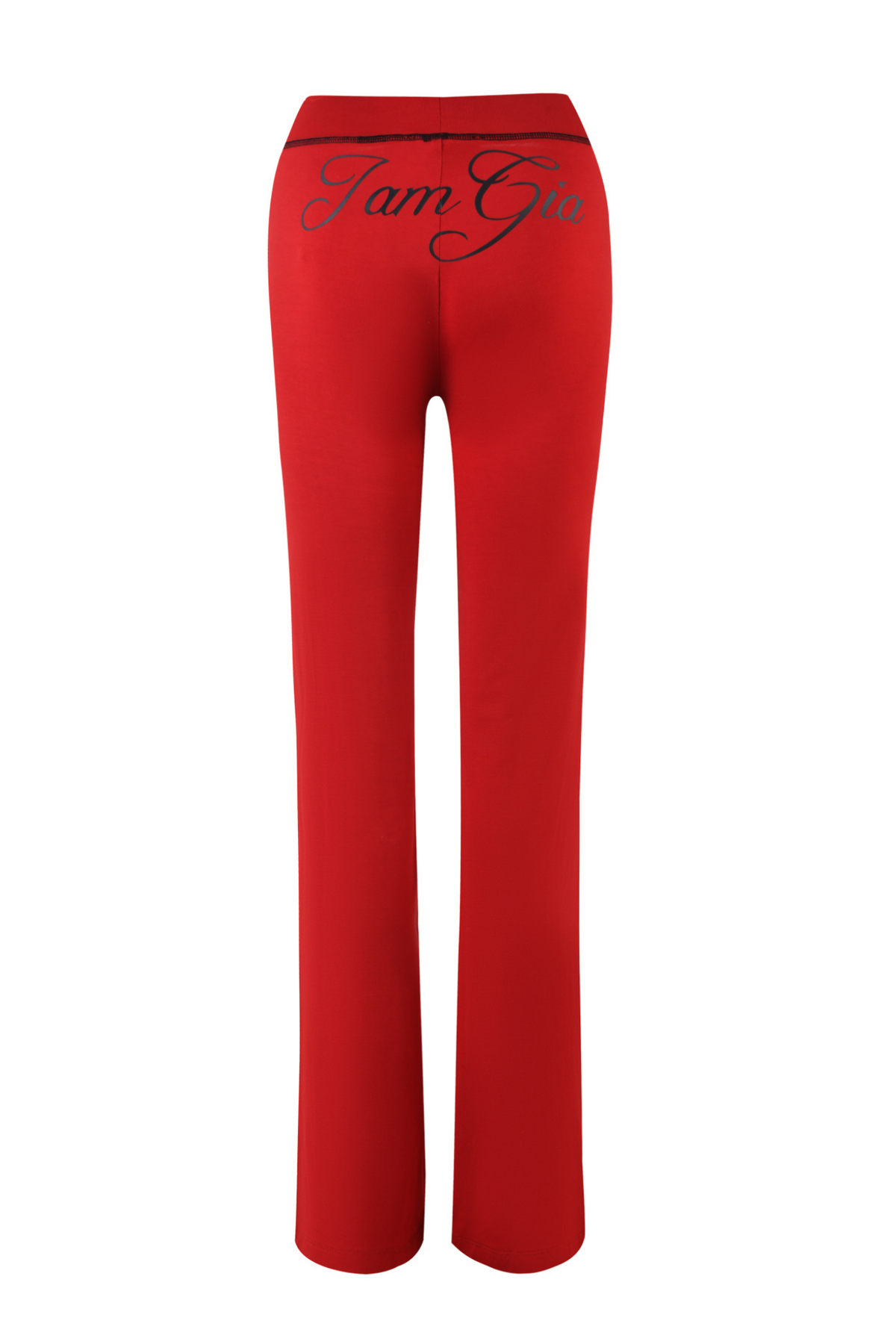 The BLARE TRACKPANT - RED by I.AM.GIA is a high-waisted track pant seen from the back, featuring “I.AM.GIA” in black cursive across the upper rear. The pants have a slim, straight-leg fit.