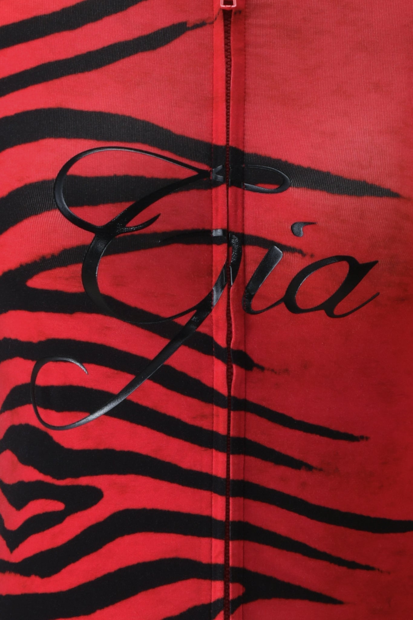 Crafted in I.AM.GIA’s signature bamboo fabrication, the BLARE HOODIE - RED WILD SIDE features a bold red Wild Side print with black tiger-like stripes and “Gia” elegantly scripted across the center—a standout detail characteristic of this striking piece.