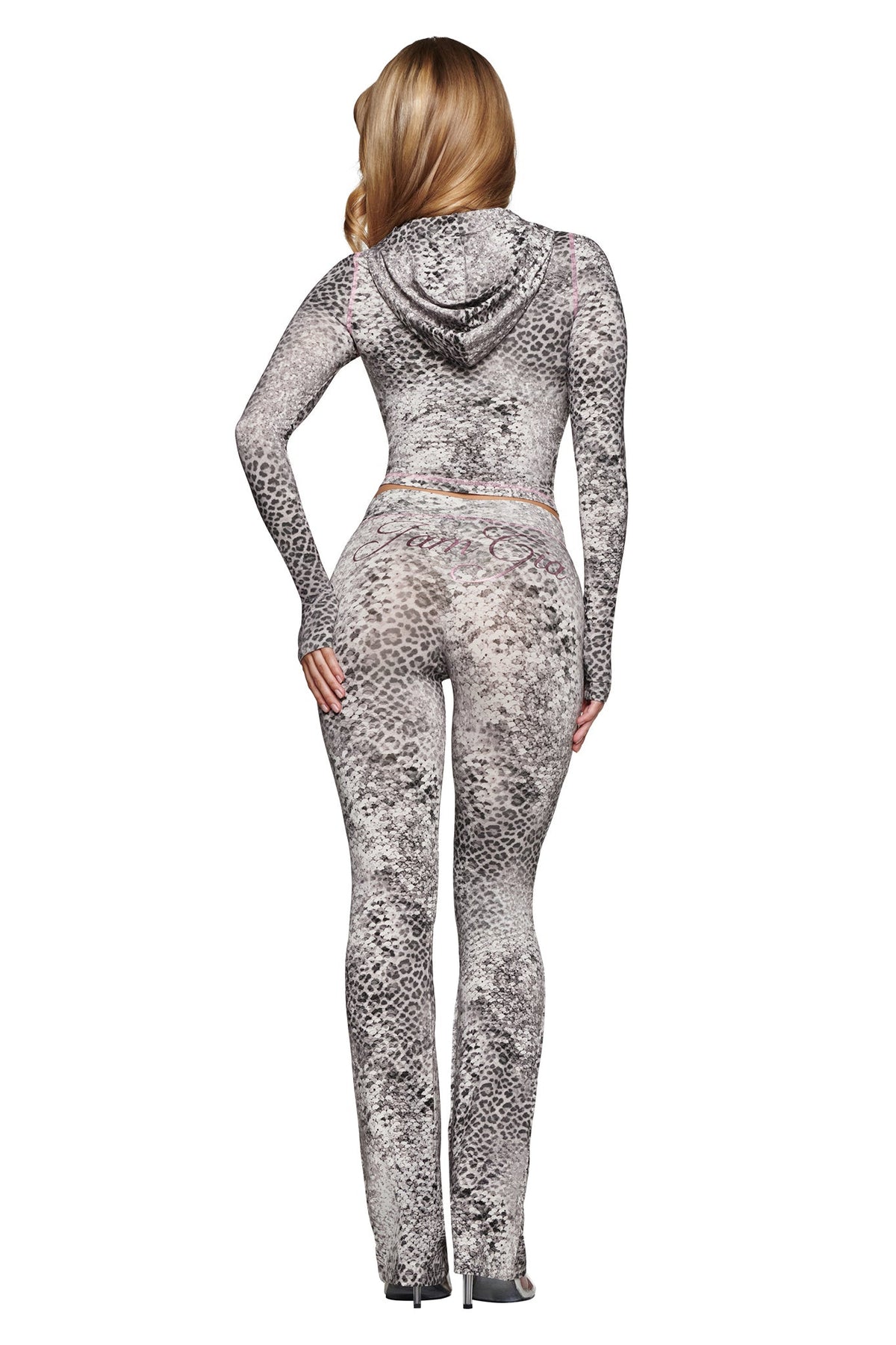 A person viewed from behind wearing a BLARE HOODIE - SILVER LUXE LEOPARD and matching silver leopard-print high-waisted flared pants.