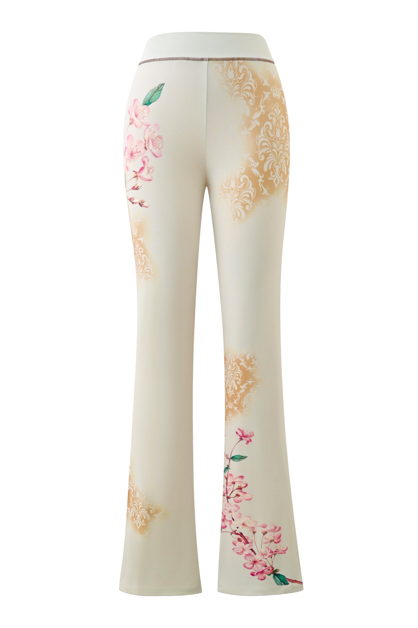 The BLARE TRACKPANT - BLOSSOM by I.AM.GIA features a cream base adorned with pink floral and gold damask-style patterns, reminiscent of elegant blossom print trackpants, shown from the back.