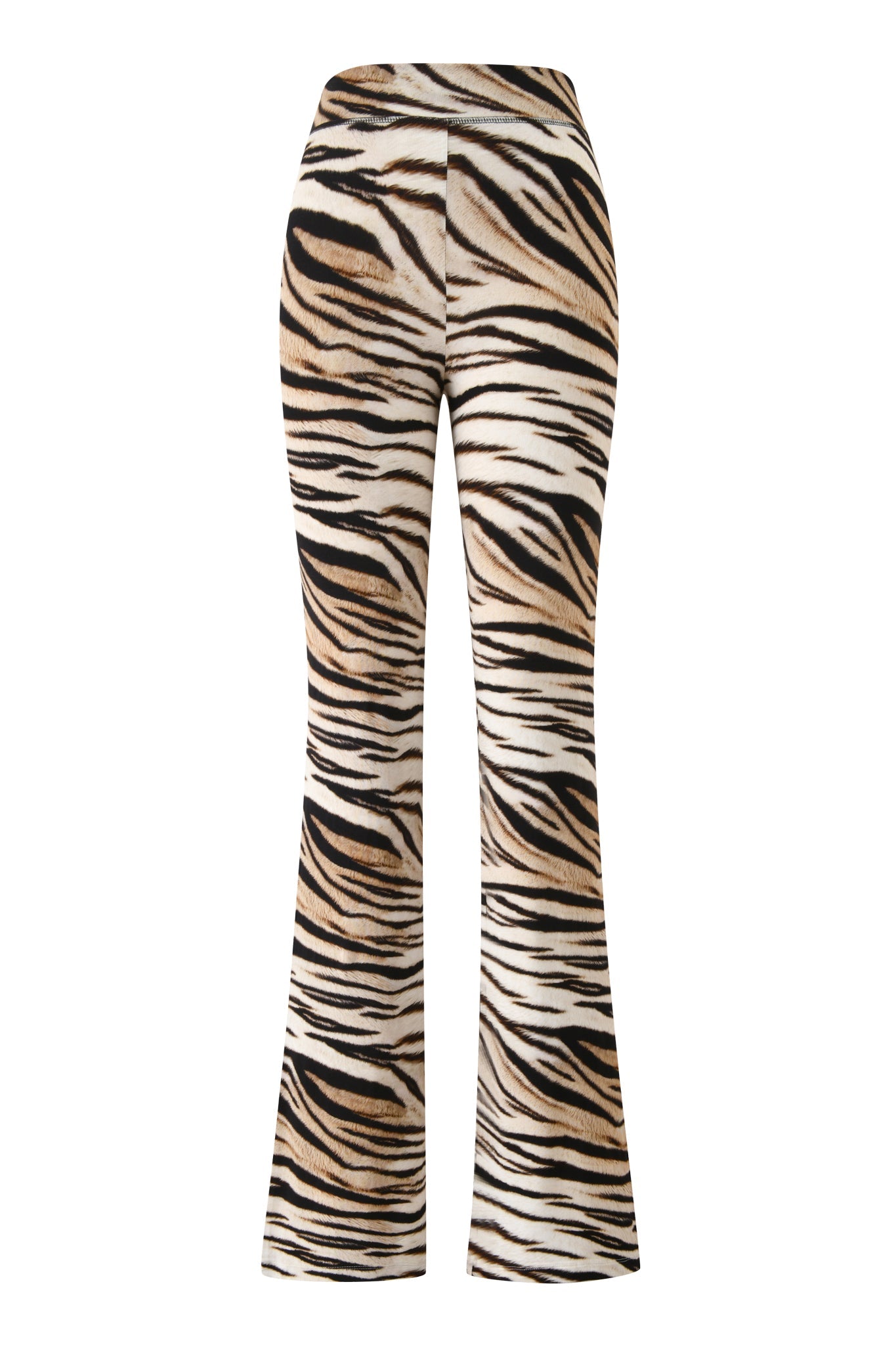 The BLARE TRACKPANT - LIGHT TIGRESS by I.AM.GIA is a high-waisted, flared pant with a bold black, brown, and white tiger stripe print. It features a fitted silhouette through the hips and thighs with a subtle flare at the hem.