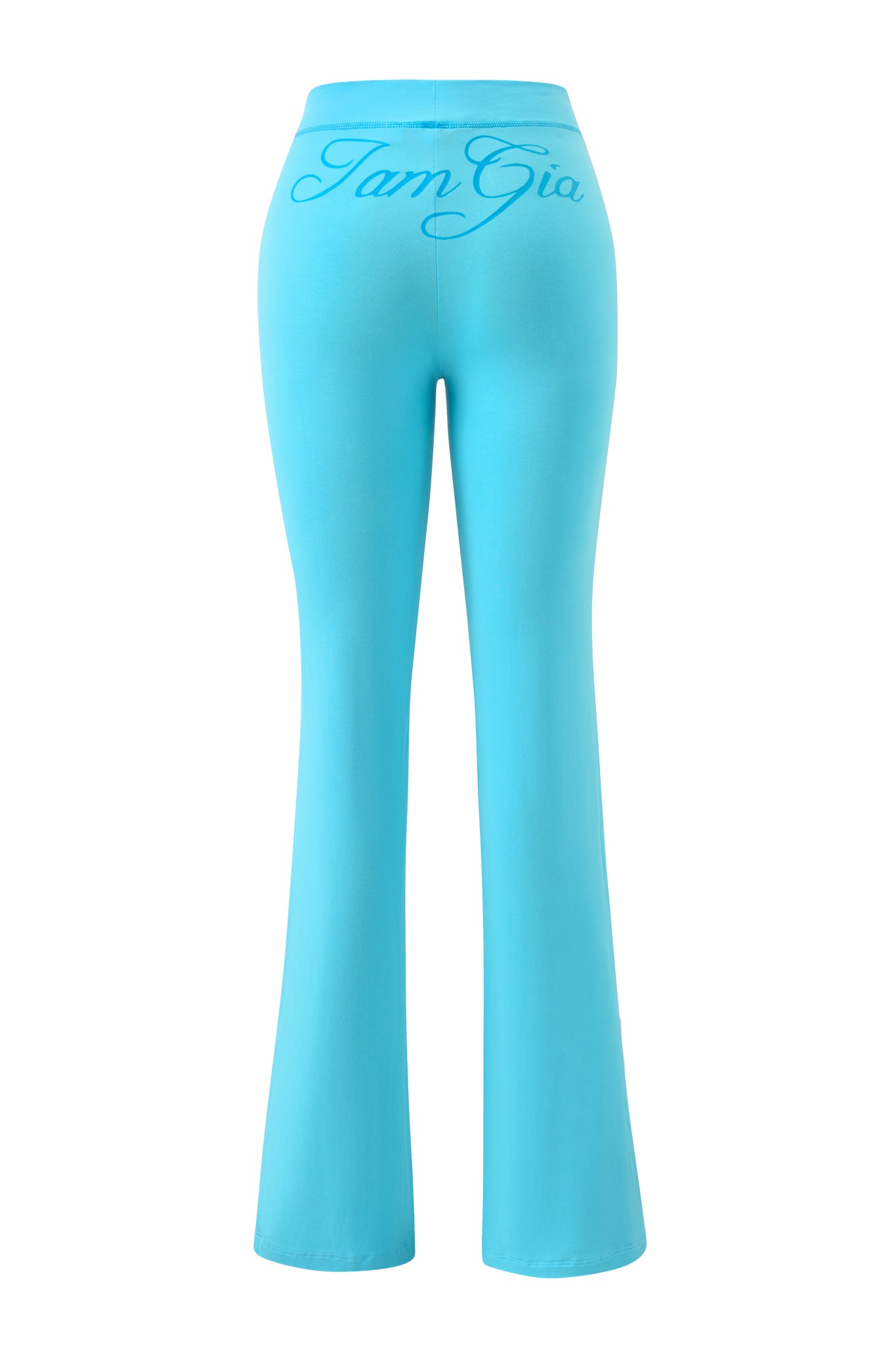 The BLARE TRACKPANT in neon blue by I.AM.GIA features a flared fit with a bold, large cursive I.AM.GIA logo across the high-waisted waistband, showcased from the back.