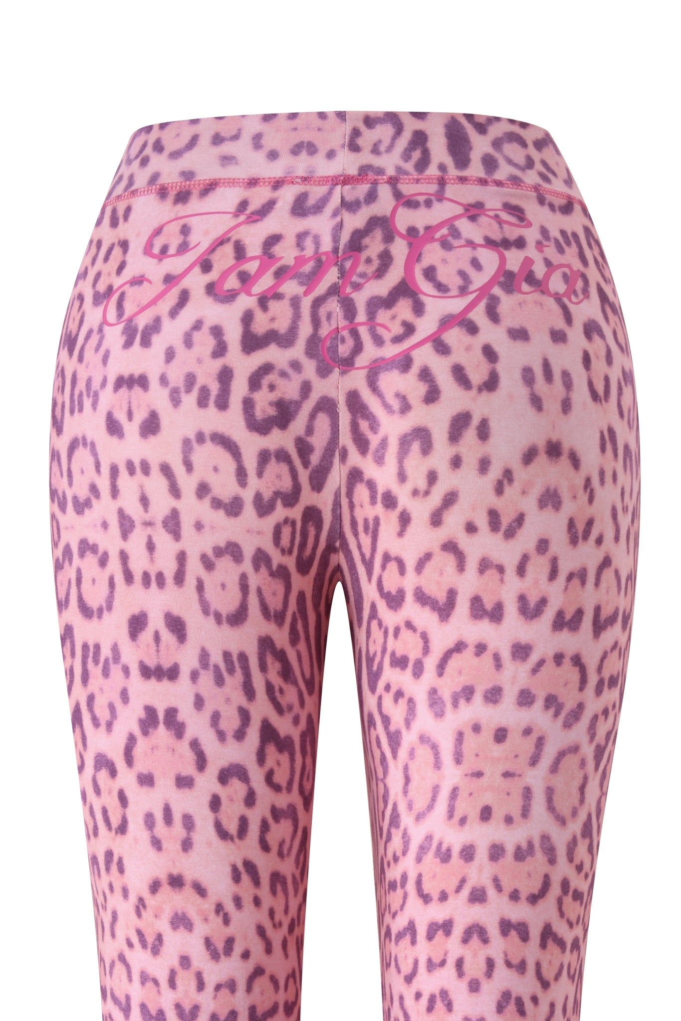 The I.AM.GIA BLARE TRACKPANT - PINK PANTHERA leggings are shown from the back, with a flared leg and a pink script logo across the waistband.