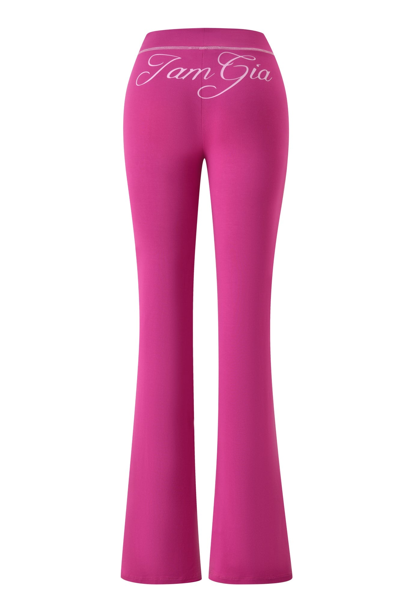 The BLARE TRACKPANT - RASPBERRY by I.AM.GIA is shown from the back in a vibrant pink shade, featuring "I.AM.GIA" in white cursive across the flared leg waistband.