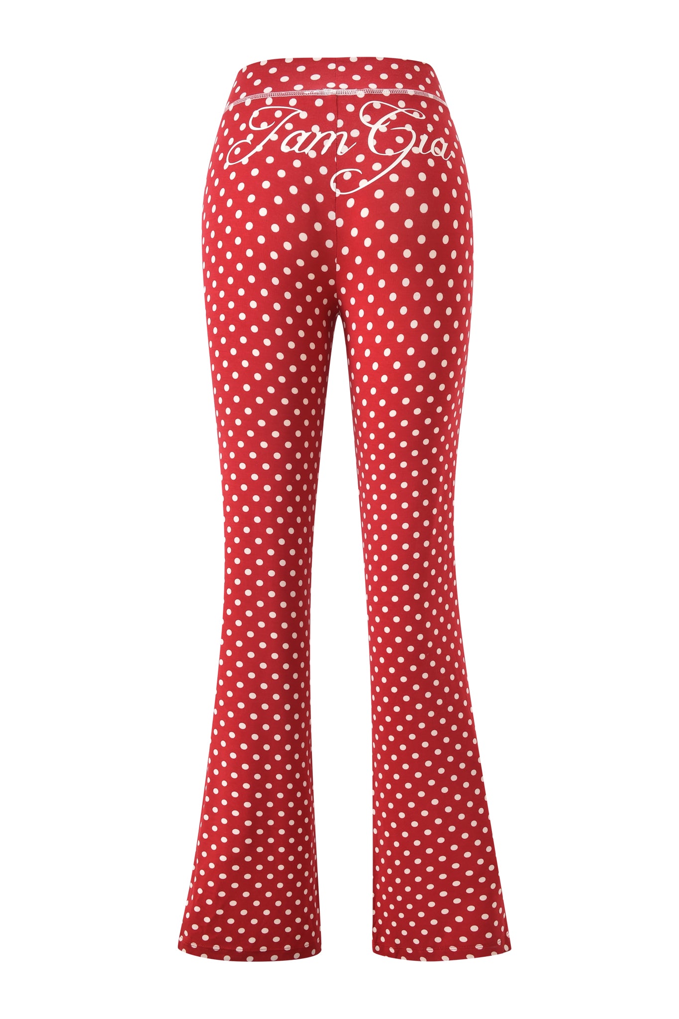 The BLARE TRACKPANT - RED POLKA DOT by I.AM.GIA features a flared fit and bold white "I.AM.GIA" cursive branding across the back waistband.