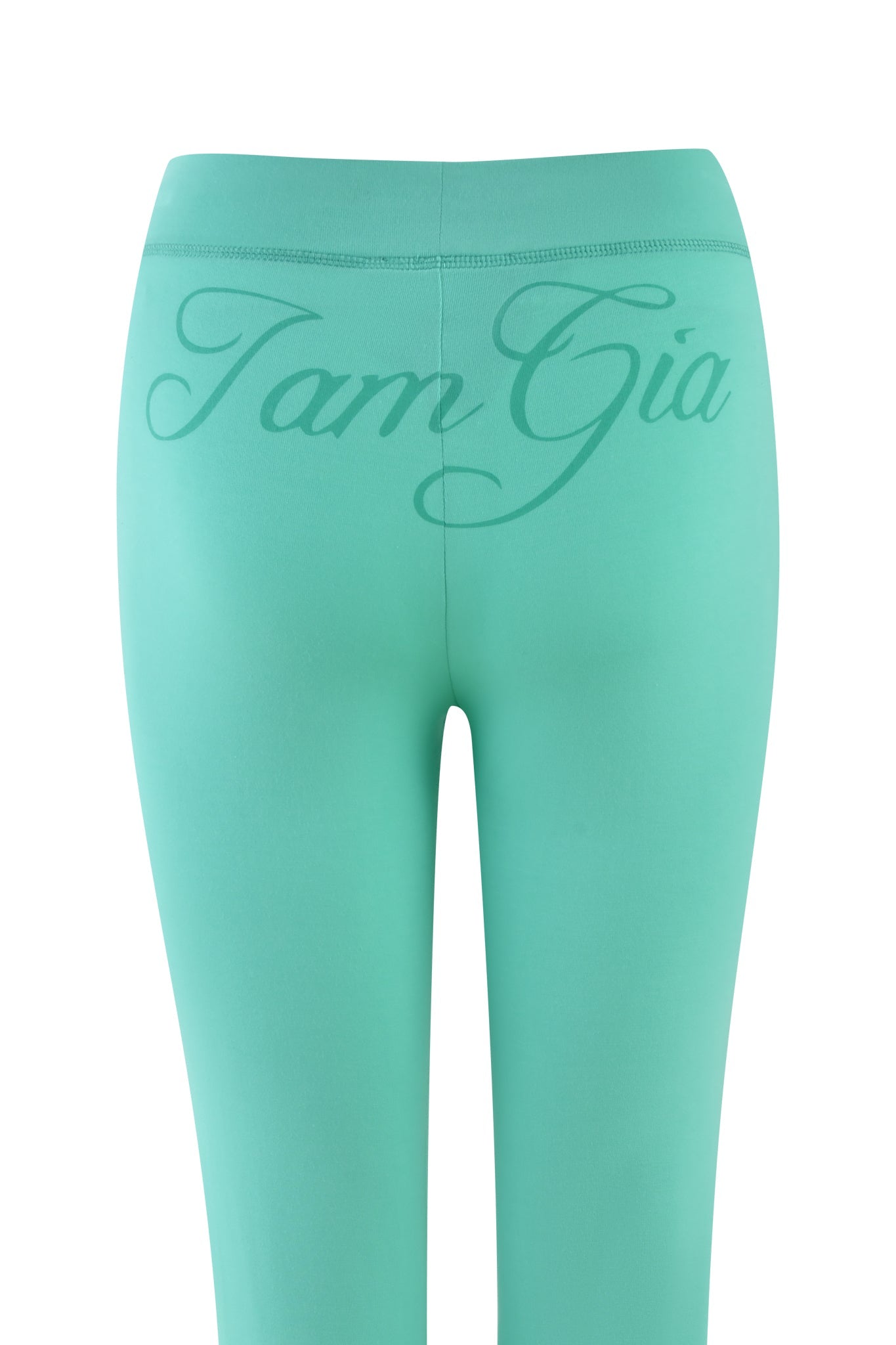 A back view of the green, turquoise, teal Blare Trackpant by I.AM.GIA, with "I am Gia" in cursive on the waistband, crafted from stretchy bamboo for ultimate comfort.