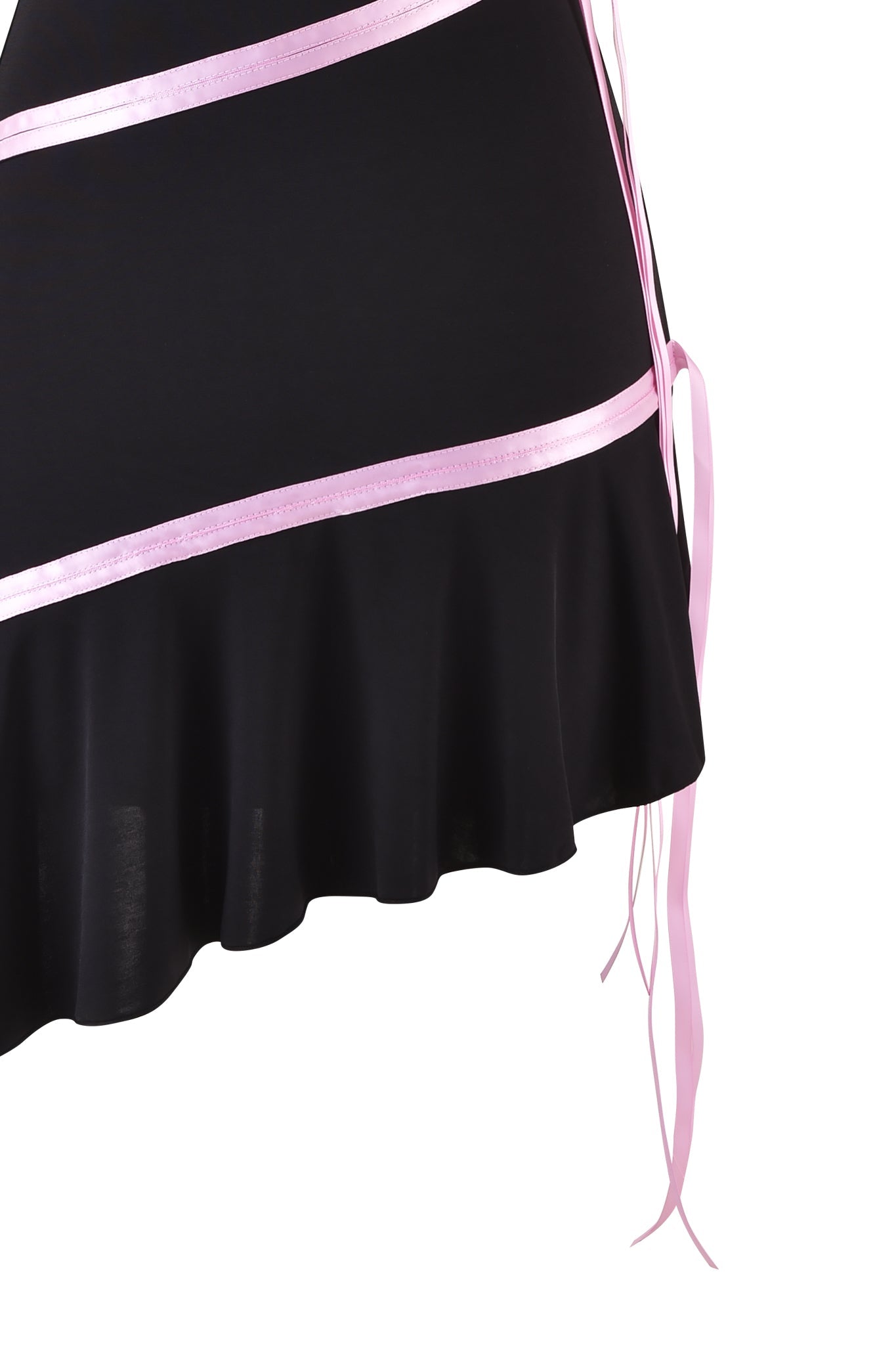 A black skirt from the I.AM.GIA brand, known as the ARLY MINI DRESS - BLACK : PASTEL PINK, showcases an asymmetrical flared hem with horizontal pastel pink ribbon stripes. Pink ribbons drape from one side, adding a decorative touch similar to the elegant Arly Dress style. The skirt is displayed in close-up against a white background.