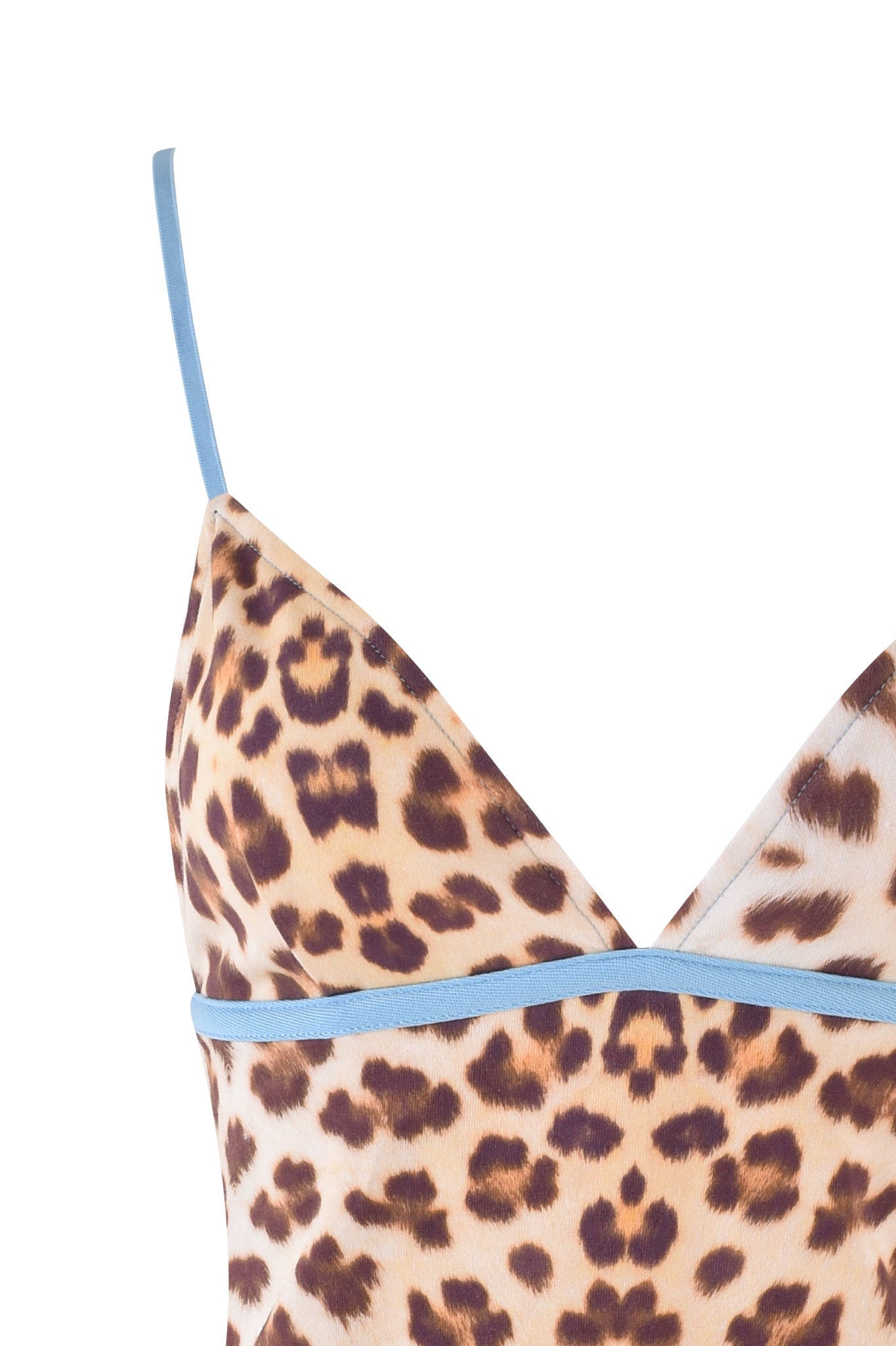 Here's a revised version of the sentence using the provided product data:

Close-up of the EDITA TOP from I.AM.GIA, featuring a leopard print with a flattering bodycon fit. The design includes thin, adjustable spaghetti straps trimmed in light blue and showcases a V-neckline that highlights the bold animal pattern against a neutral backdrop.