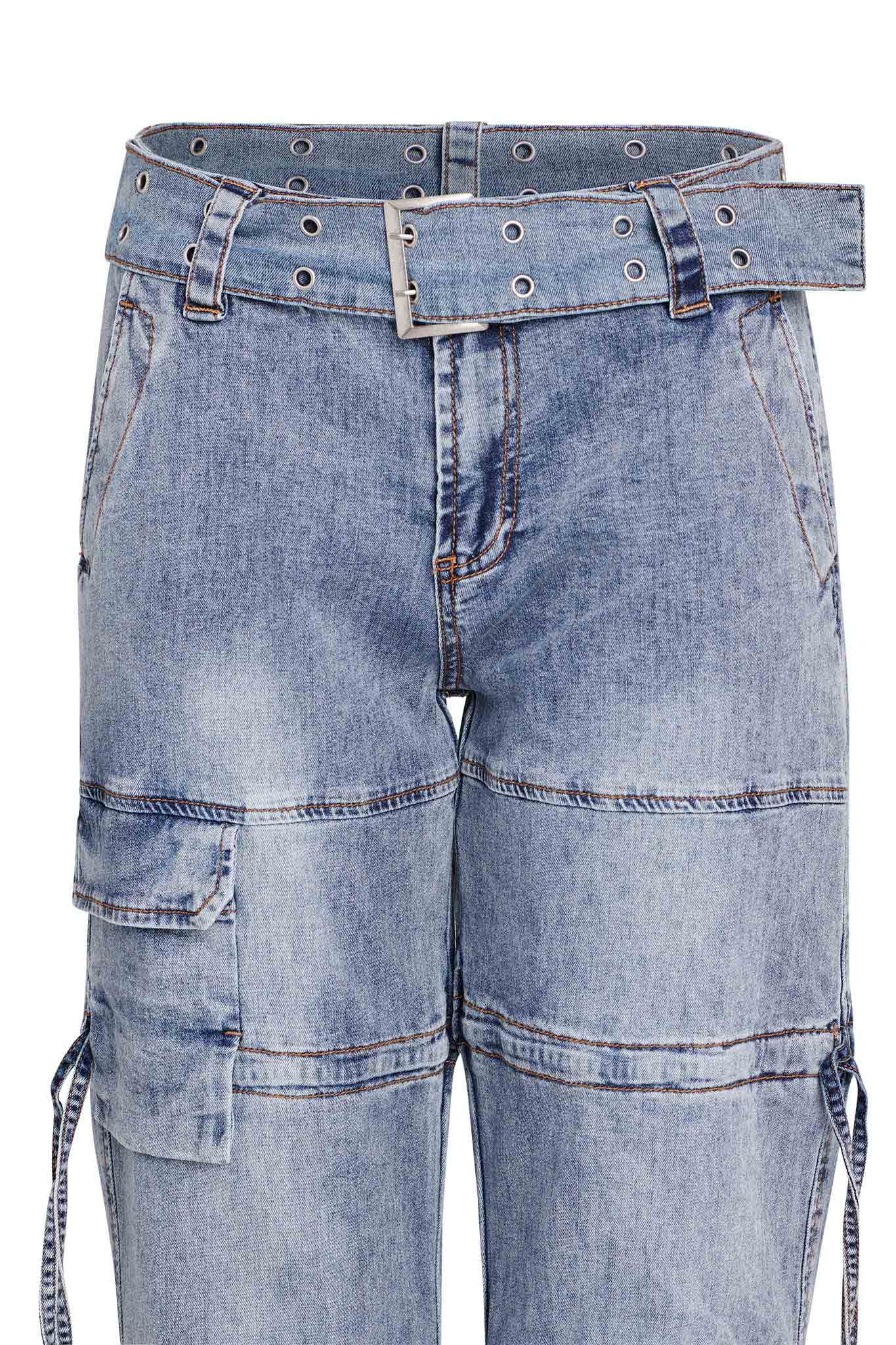 A close-up of the light blue NAIMA CARGO PANT - DENIM by I.AM.GIA, showcasing multiple pockets and intricate stitching details. The pants include a matching blue denim belt with metal eyelets and a rectangular metal buckle. The image highlights the front view of the upper section of these jeans.