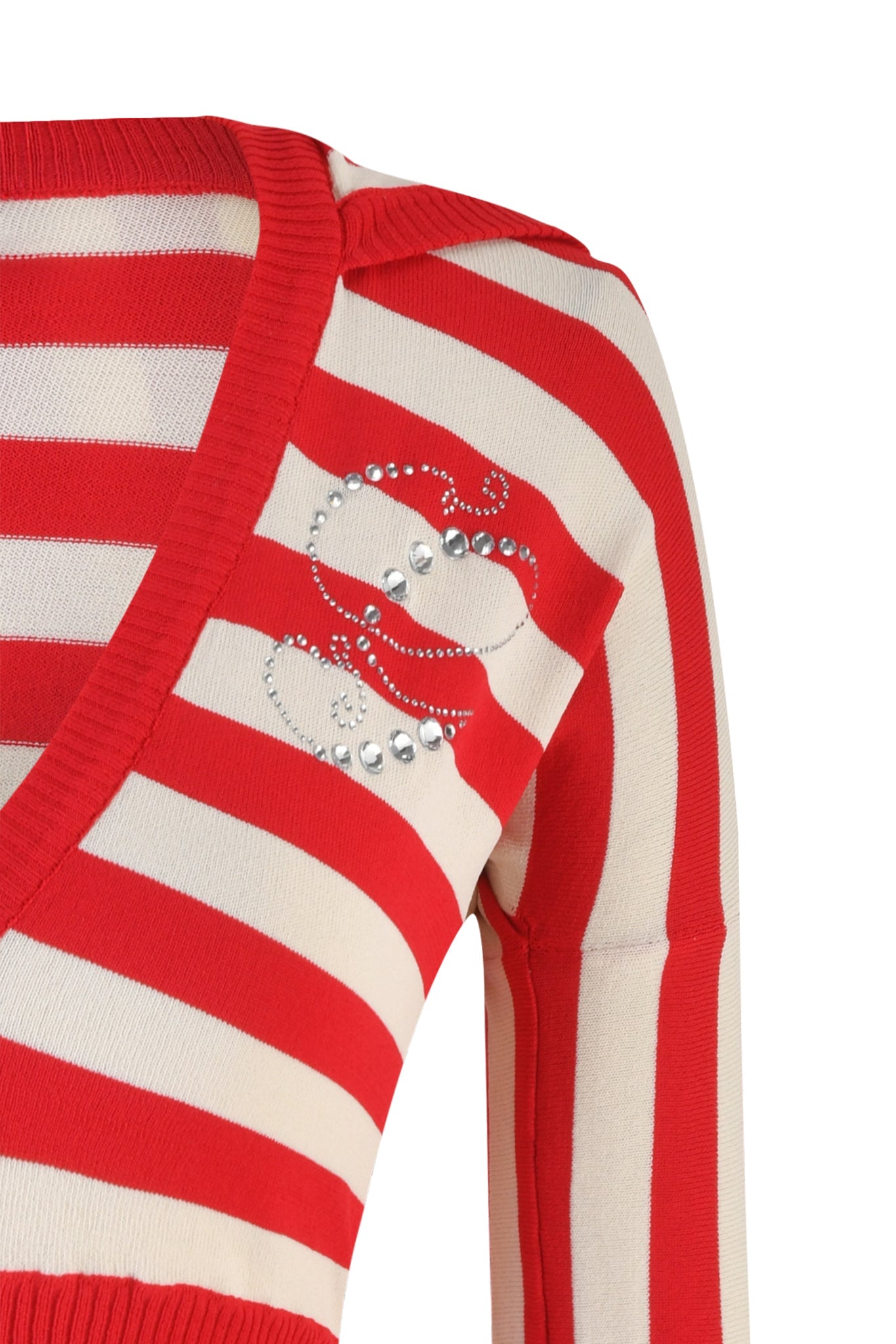 A close-up of the I.AM.GIA SUZI SWEATER - RED : STRIPE reveals its red and cream striped design with a V-neckline. Silver rhinestone embellishments arranged in a floral pattern adorn the upper left section near the shoulder. The sweater also features ribbed hems.