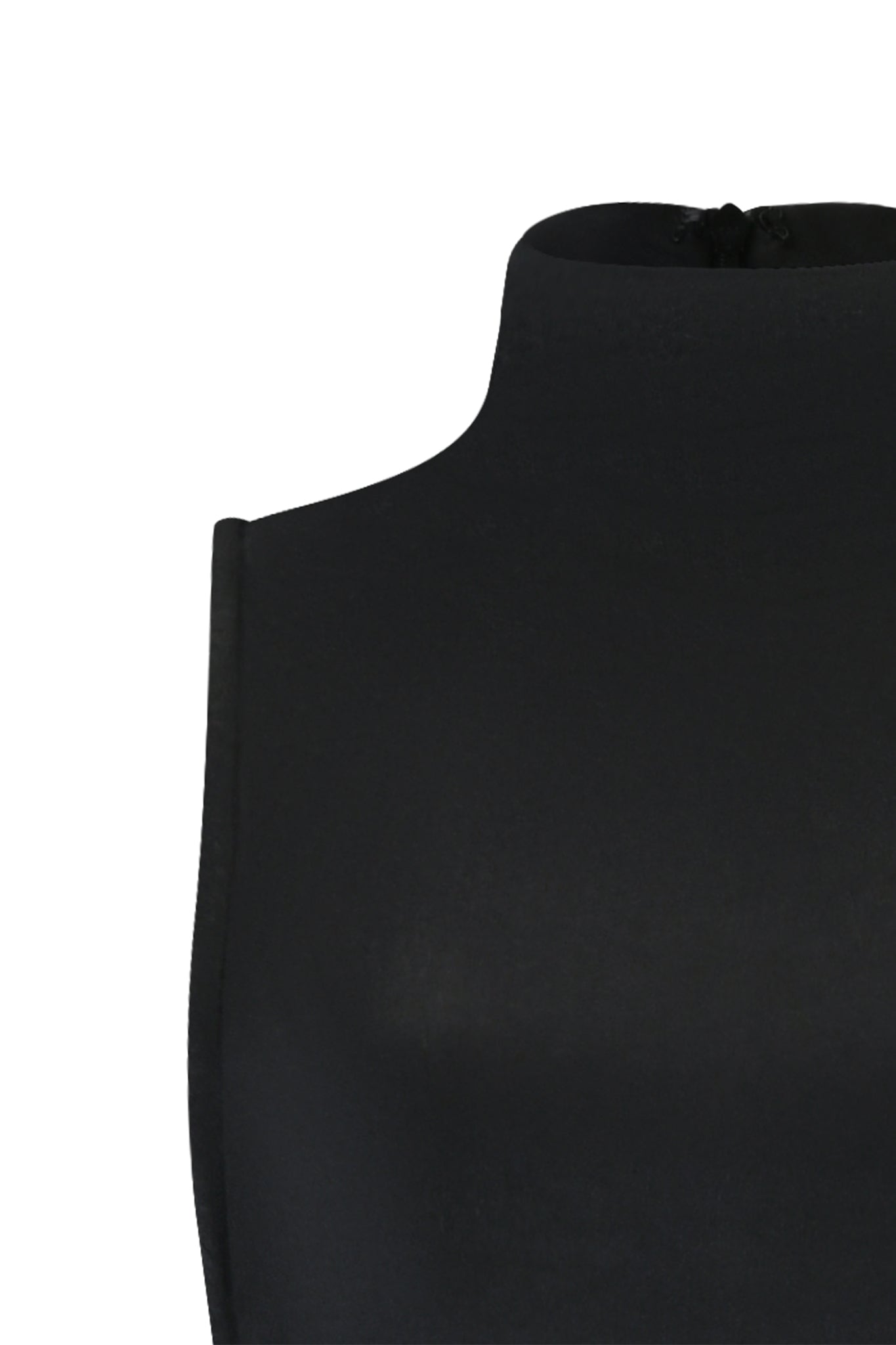 Close-up of an I.AM.GIA TAGAN MAXI DRESS - BLACK, highlighting the sleek neck and shoulder sections. The fabric appears smooth and form-fitting, with minimal visible detailing. The background is plain white.