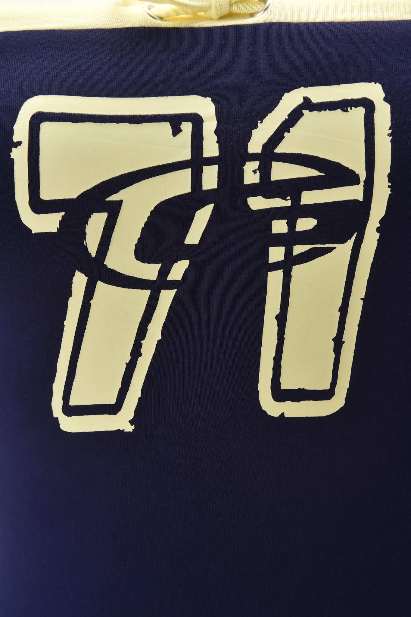 The MICHELLE BOOB TUBE - NAVY by I.AM.GIA features a yellow outlined number 77 in a rough, hand-drawn style on dark blue fabric, creating a bold look on this strapless bodycon tube top.