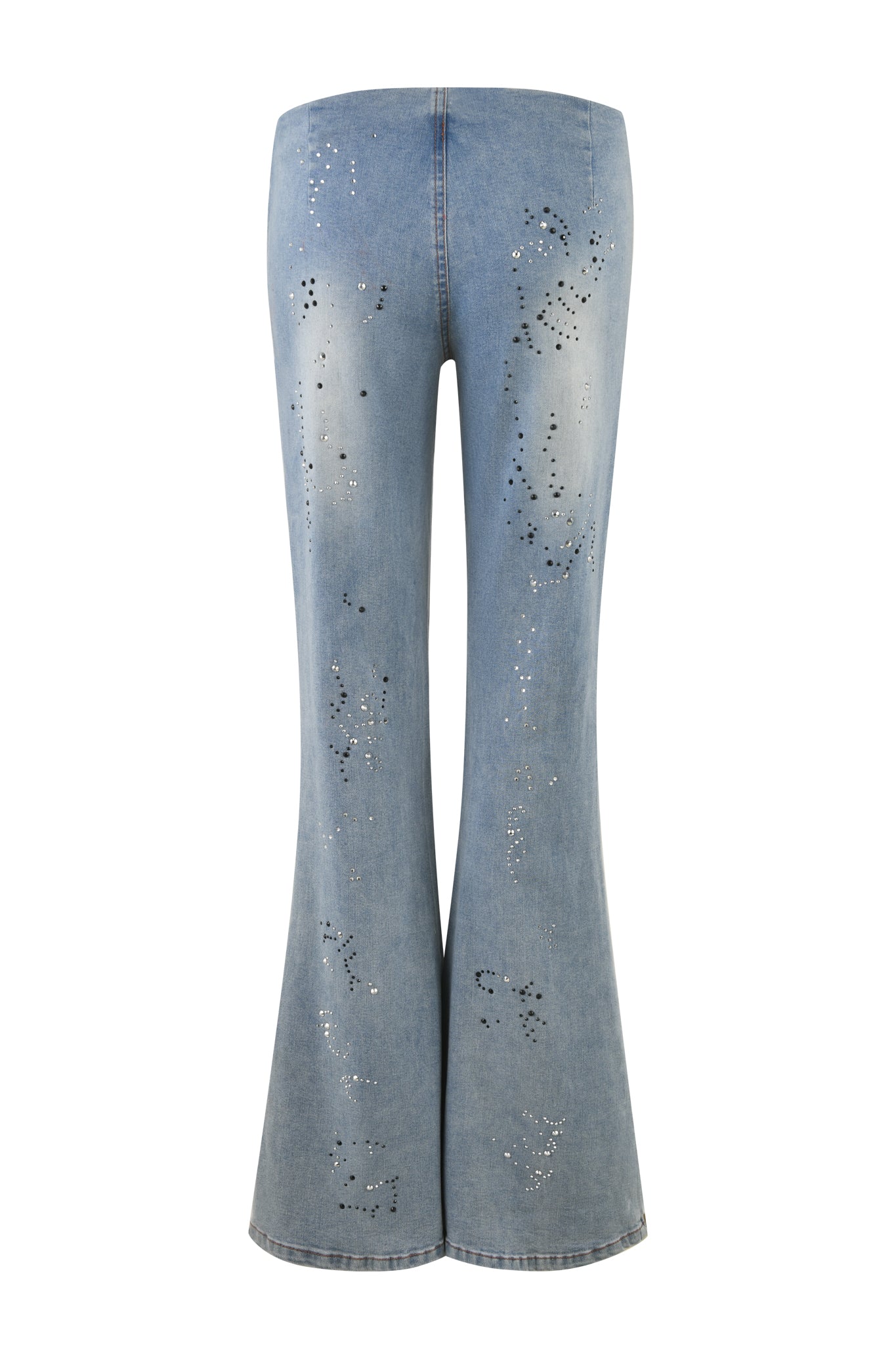 Introducing the REQUIEM JEAN - BLUE : DENIM BLUE by I.AM.GIA, a pair of light blue denim jeans showcasing a flared silhouette with scattered diamante embellishments in various patterns. These jeans feature a fitted waist and thighs, flaring out from the knees to the hem, and boast fabric that exhibits a slightly faded, vintage wash.