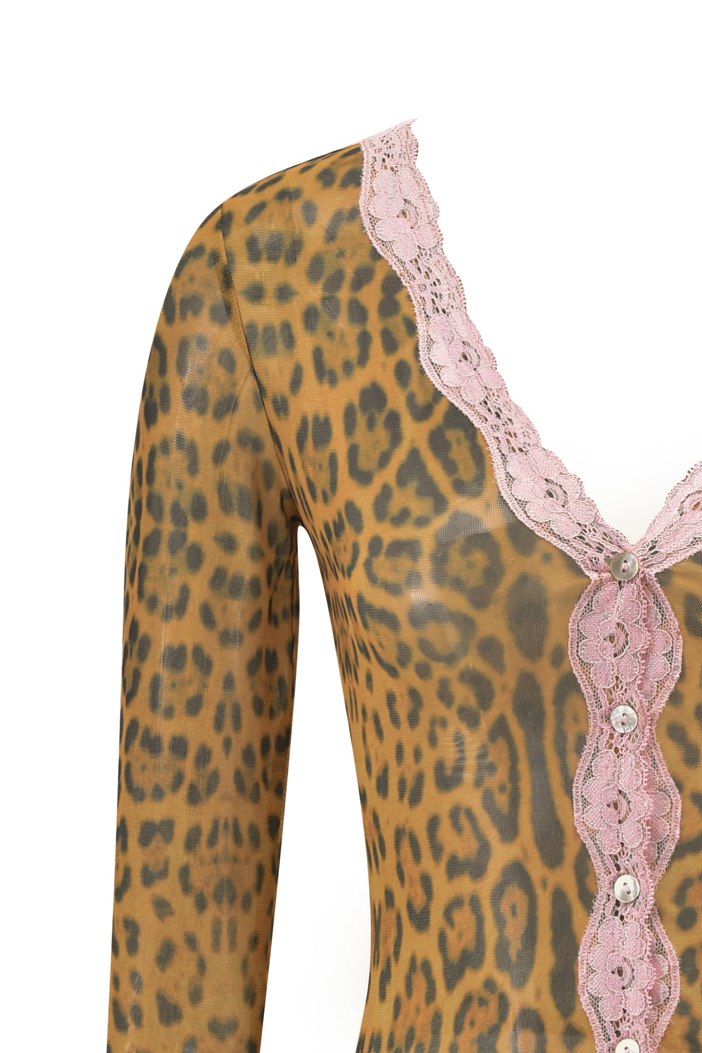 Close-up of the I.AM.GIA TASHI TOP - PANTHERA, a sheer long-sleeve with cheetah print, deep V-neckline trimmed in pink lace, and button details. Mannequin partially visible.