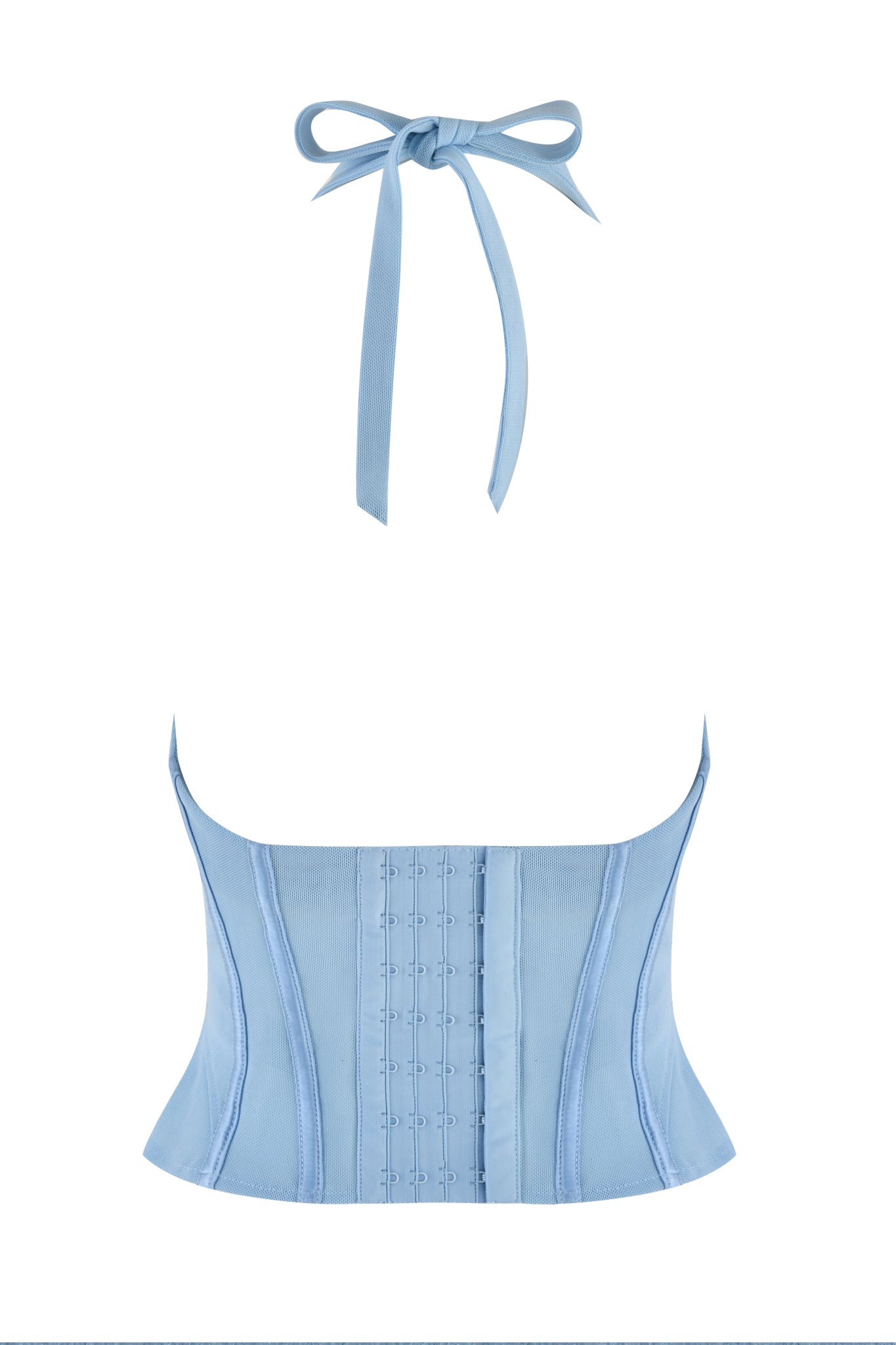 The LOLA Corset Top - Blue, designed by I.AM.GIA in a delicate baby blue shade, showcases satin bust cups and a chic bow-tie halter neckline. Its front is adorned with hook detailing, complemented by structured stitching accents that craft a refined silhouette. The elegantly draping bow enhances the timeless elegance of this remarkable piece.