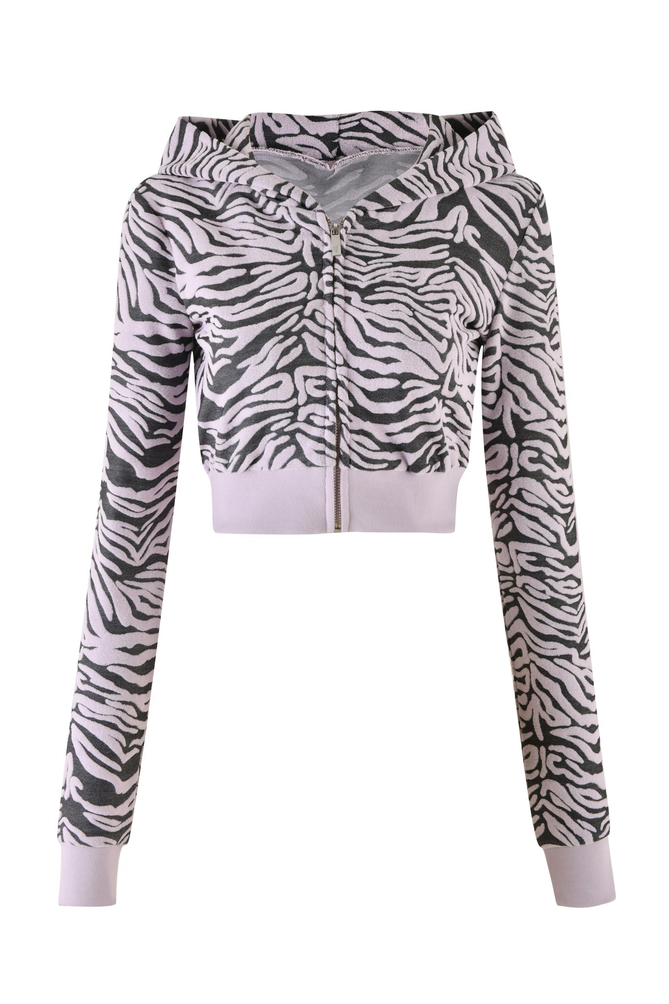The SOLIS HOODIE - PINK : ZEBRA by I.AM.GIA is a cropped zip-up hoodie featuring a striking black and white zebra ombre print. It comes with long sleeves and a hood, with the zipper running down the center of the front.
