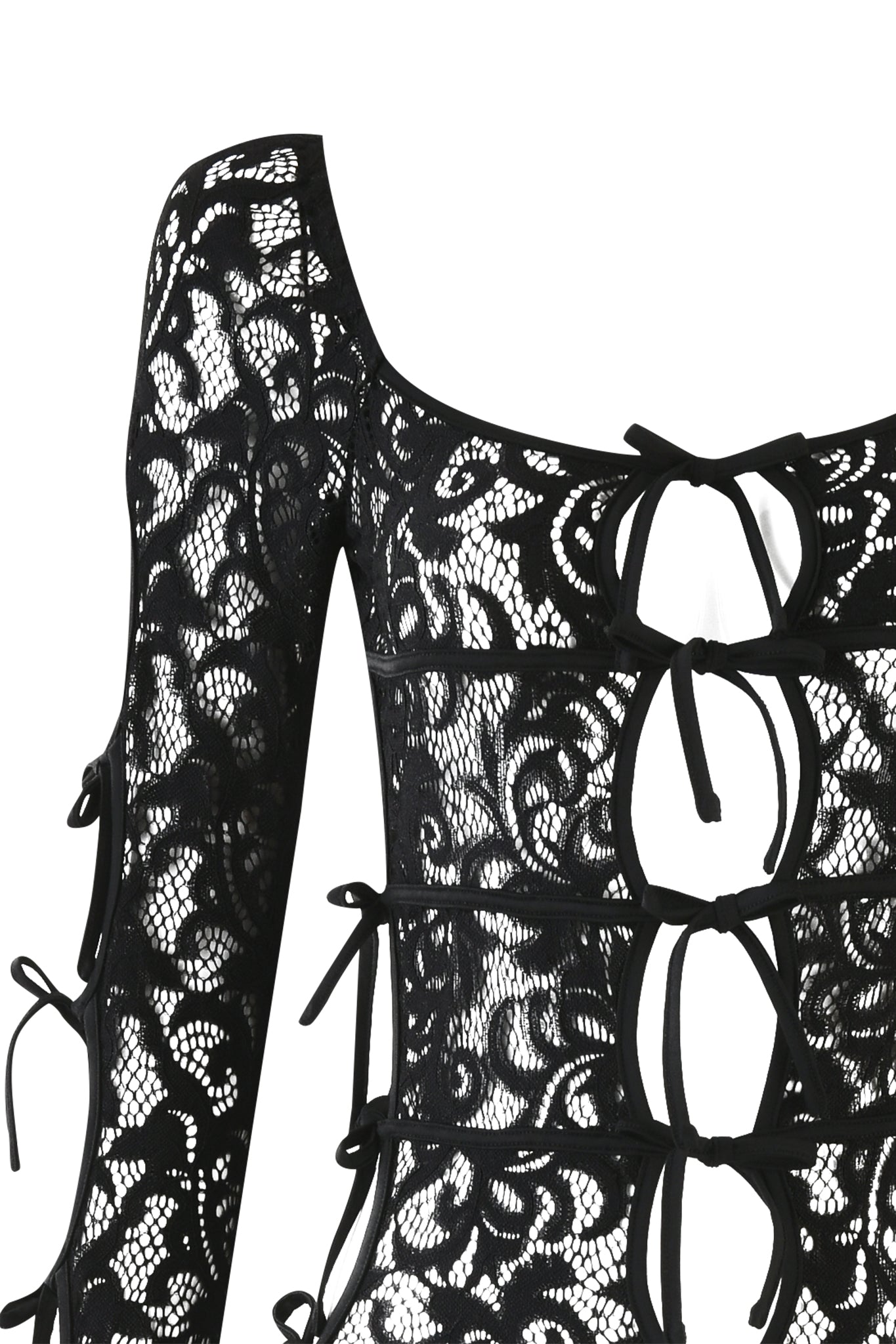 Close-up of the LYSANDRA CATSUIT in black from I.AM.GIA. This long-sleeved design features multiple front cutouts tied together with black strings, creating an intricate, almost corset-like pattern against the translucent lace fabric.