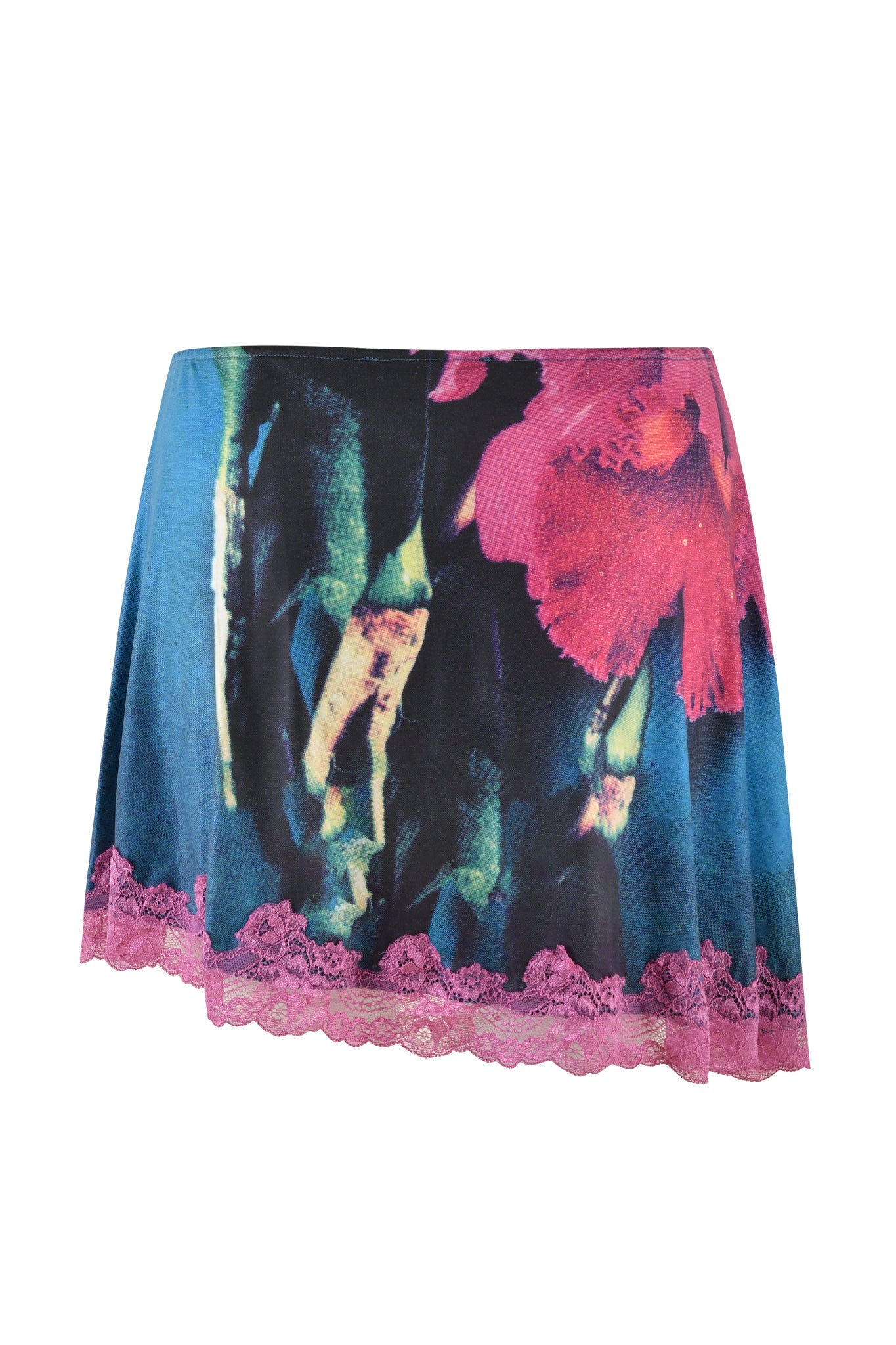 The ODETTA SKIRT - MULTI by I.AM.GIA is a vibrant, floral mini skirt featuring large pink flowers and green foliage set against a dark background. Its mid-rise A-line silhouette enhances its charm, while the hem is adorned with a delicate light purple lace trim.