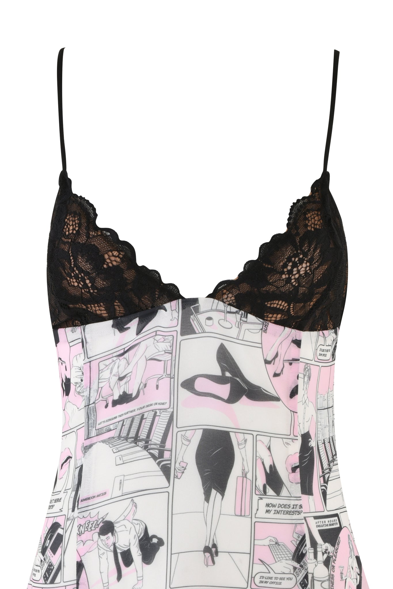 A close-up image of the I.AM.GIA ROSIE DRESS in pink showcases its black lace trim at the neckline and thin straps. The Georgette mini dress fabric features a custom hand-drawn digital comic print in black, white, and pink hues, depicting various illustrated scenes and characters.