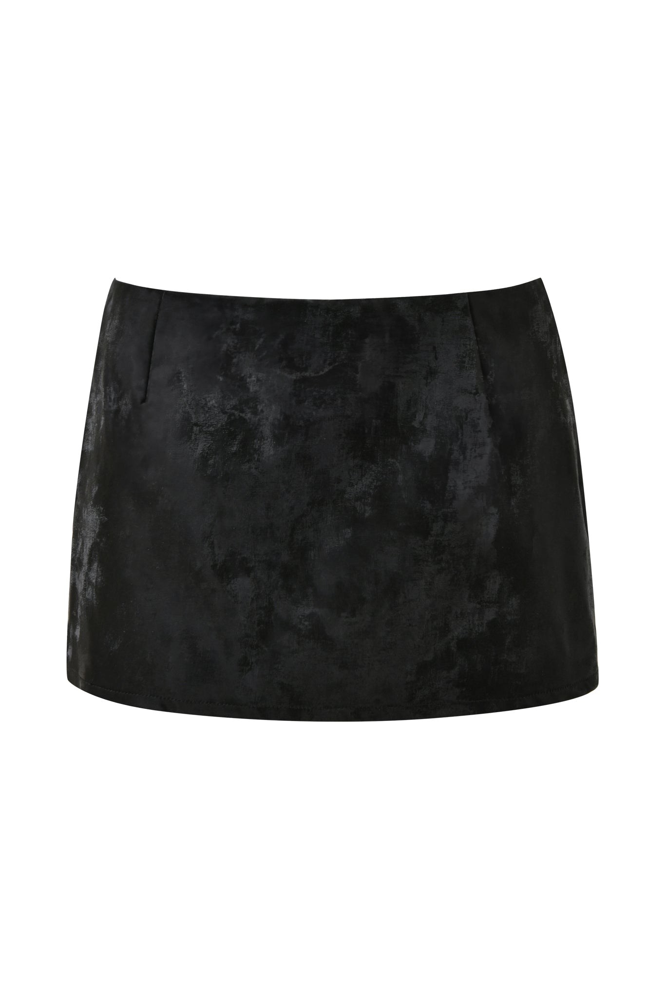 A close-up image of the FRANCINE SKORT - BLACK by I.AM.GIA, featuring a textured, slightly glossy finish. This mini skort boasts a simple, straight cut, creating a sleek and modern appearance. The plain white background highlights its details beautifully.
