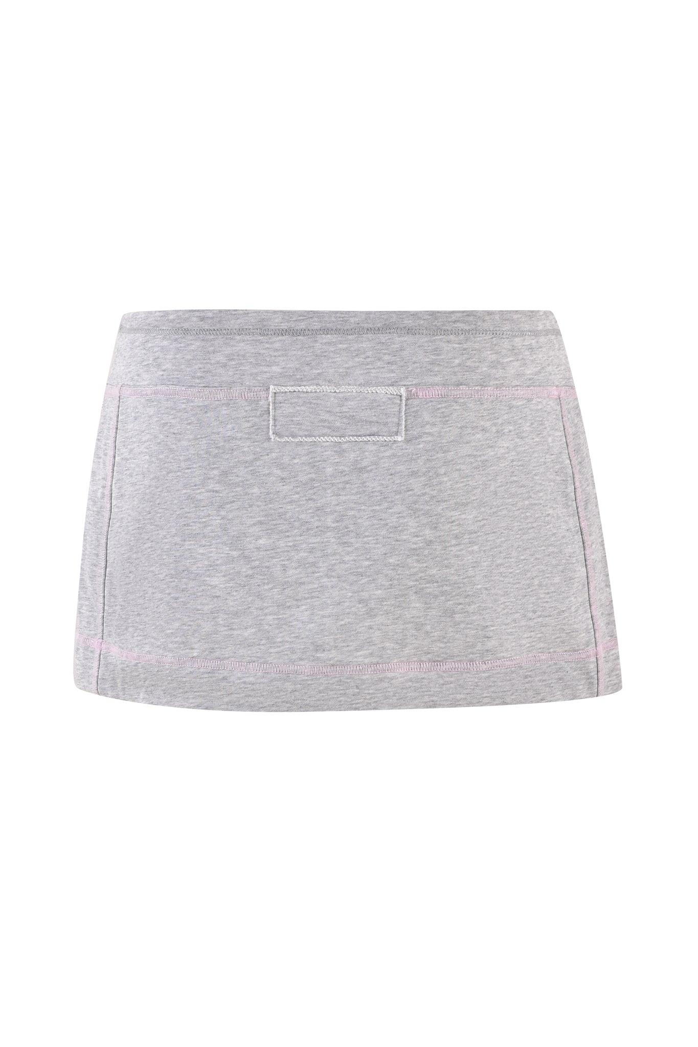 The EZORA SKORT 2.0 - GREY by I.AM.GIA features a light gray design with subtle pink stitching and a rectangular patch on the front. The soft fabric provides comfort, and its bodycon fit enhances the simple, casual style with a low-rise waistline.