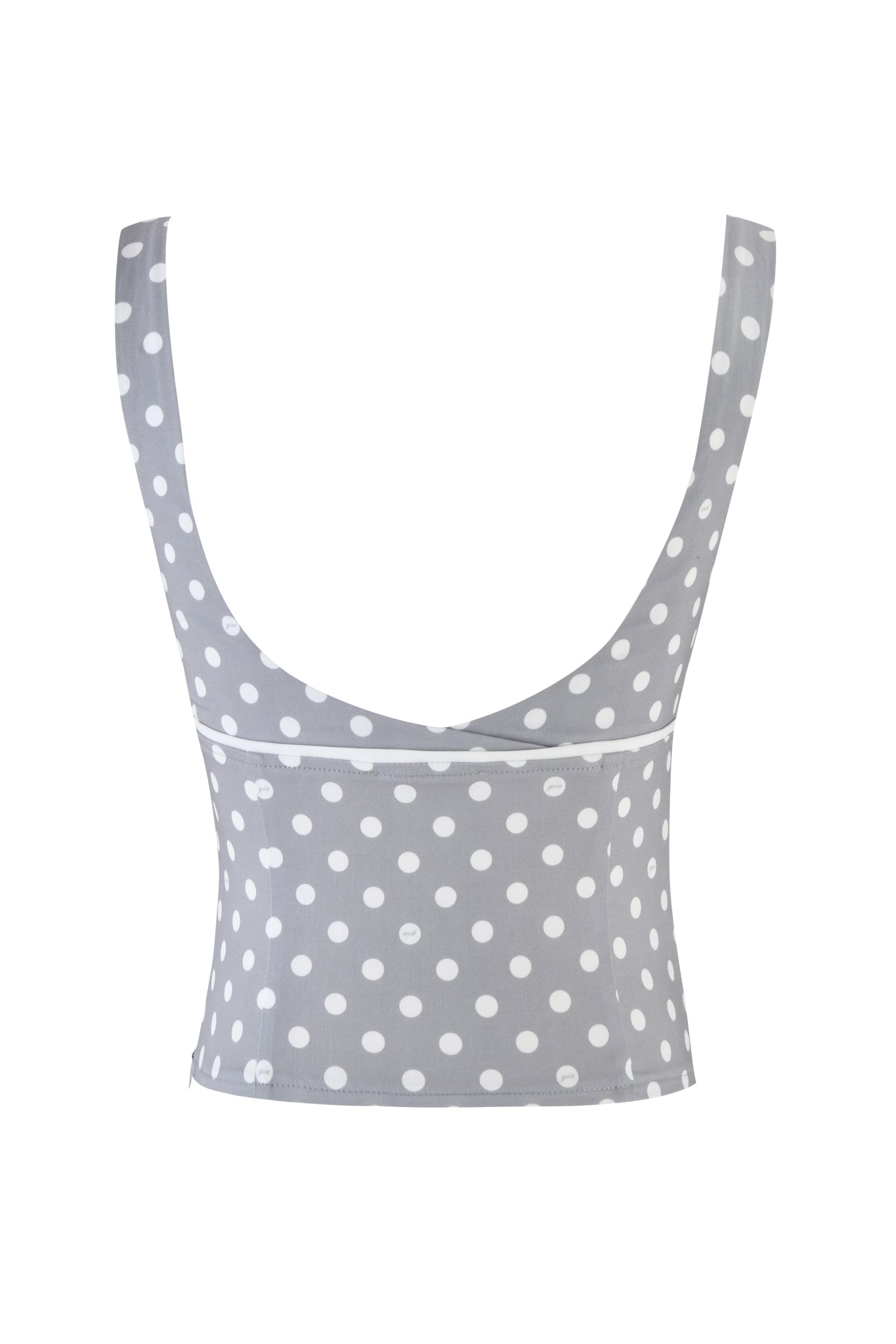 The MELDA TOP - GREY by I.AM.GIA features a tailored fit with a white polka dot pattern on grey fabric, enhanced with lace detailing and a chic low-cut back.